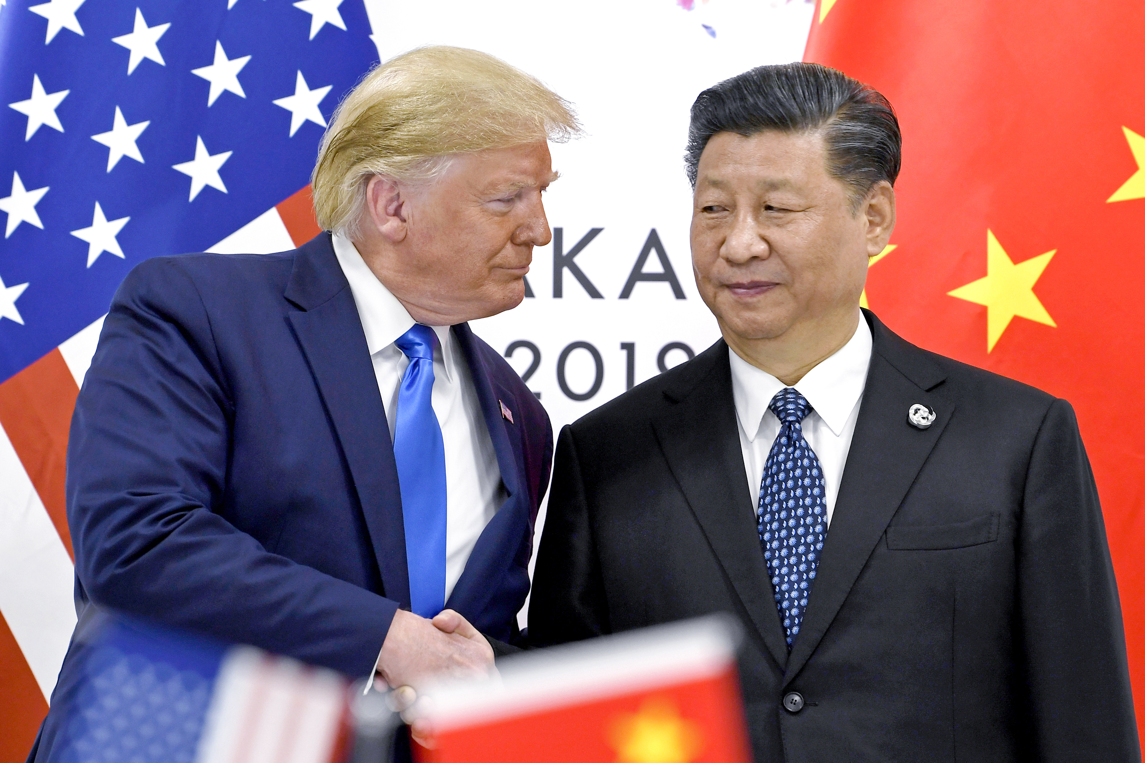 President Donald Trump, left, shakes hands with China's President Xi Jinping during a meeting on the sidelines of the G-20 summit in Osaka, Japan, June 29, 2019. (AP Photo/Susan Walsh,