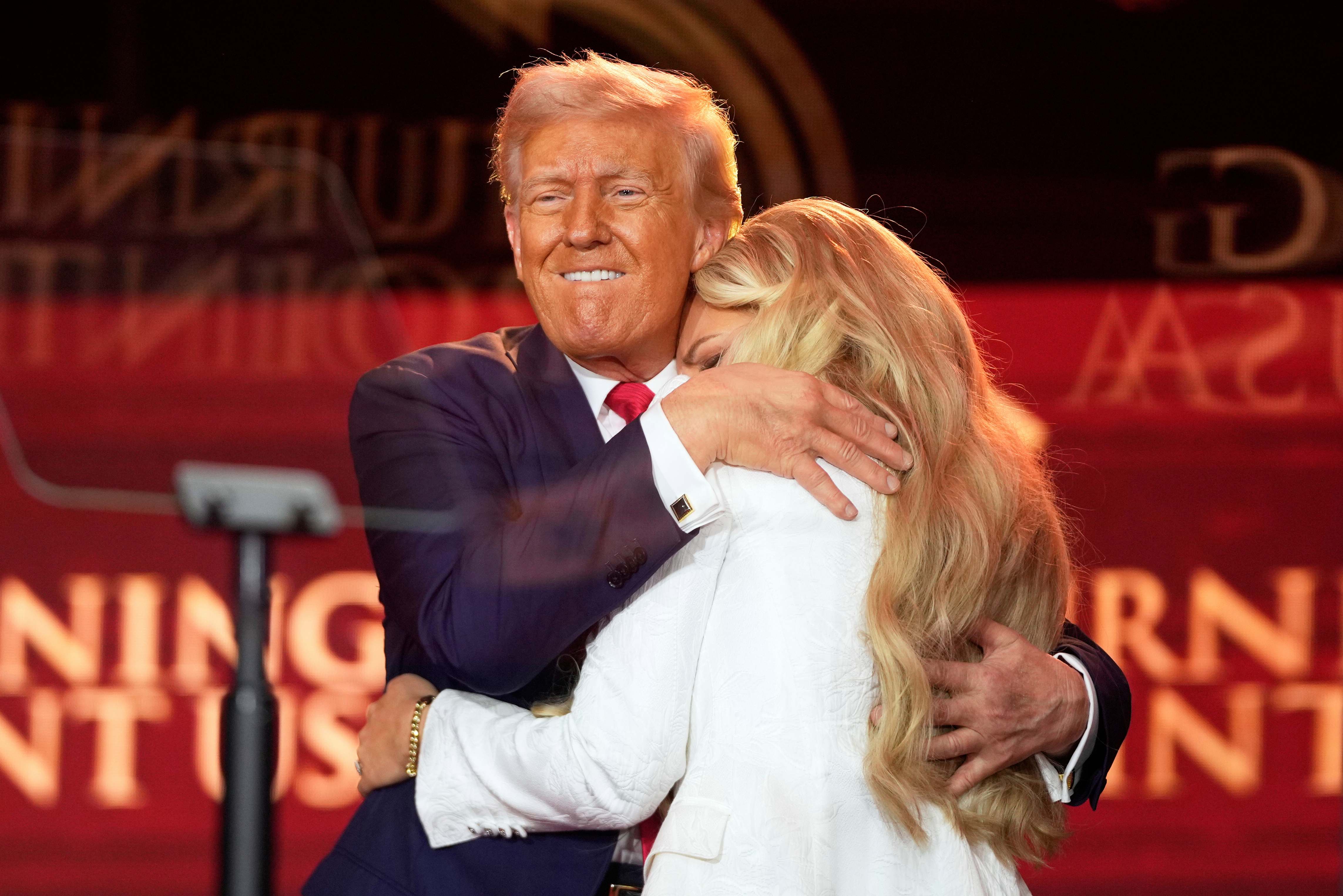Donald Trump hugs Erika Kirk