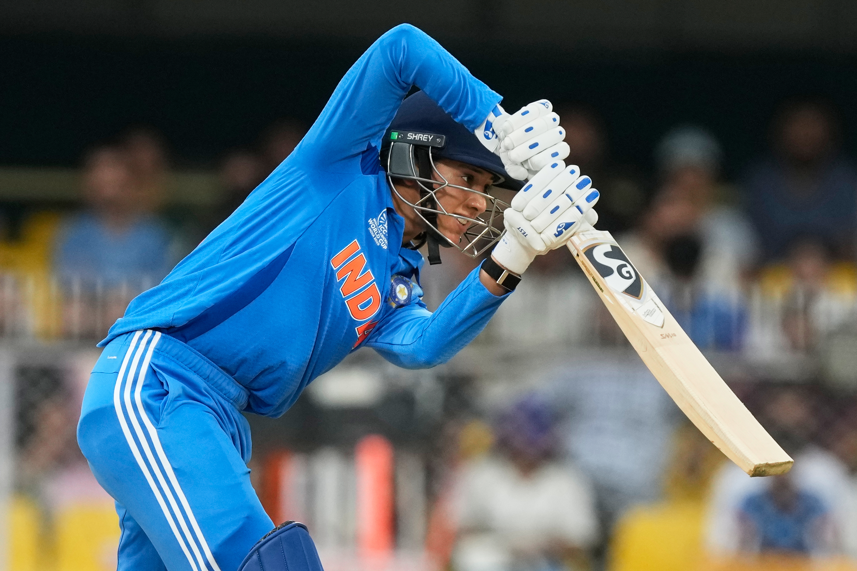 India's Smriti Mandhana plays a shot during the ICC Women's Cricket World Cup match between India and Sri Lanka at Barsapara Cricket Stadium in Guwahati, India, Tuesday, Sept. 30, 2025. (AP Photo/Anupam Nath)