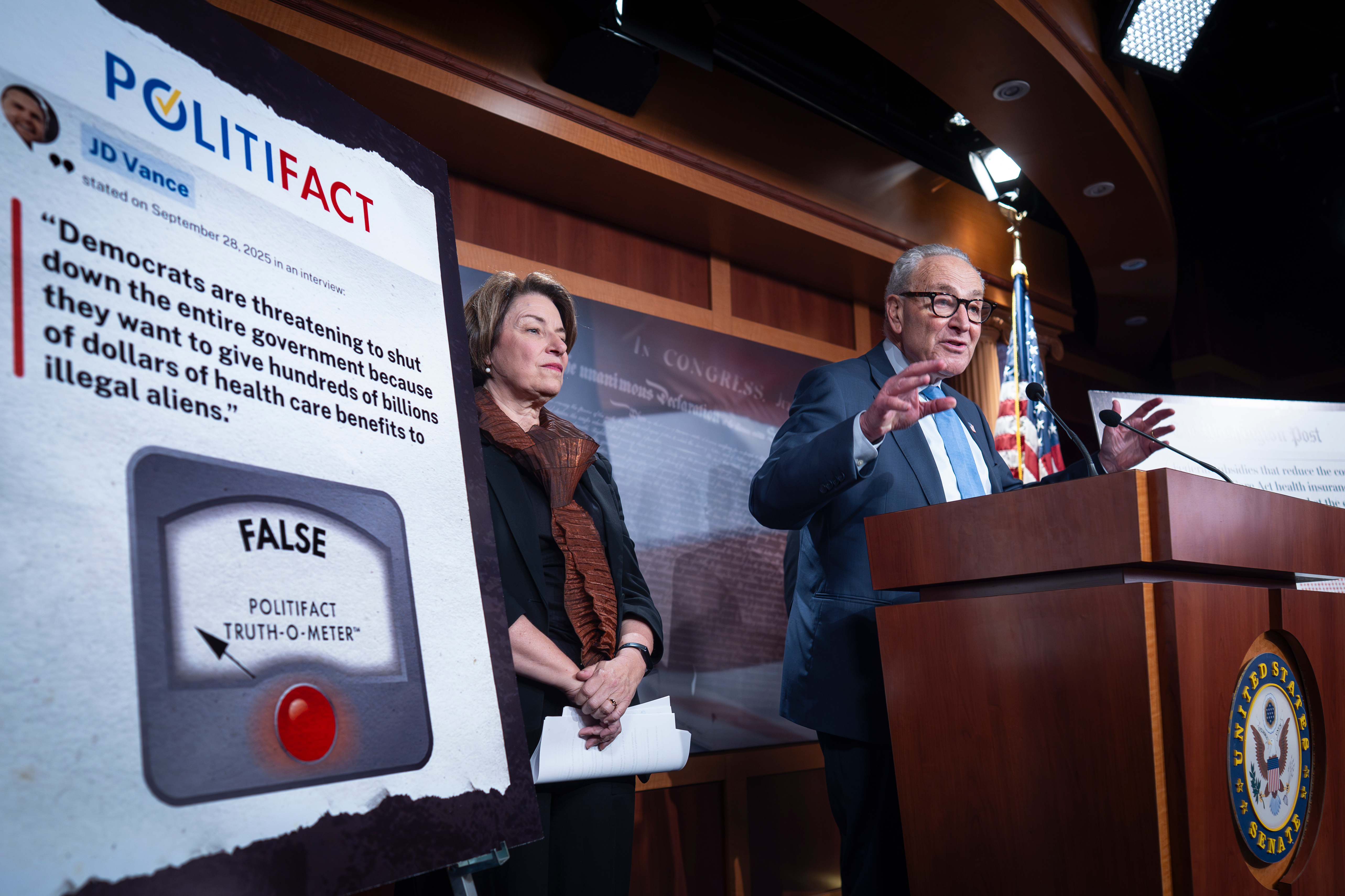 Chuck Schumer holds a briefing.