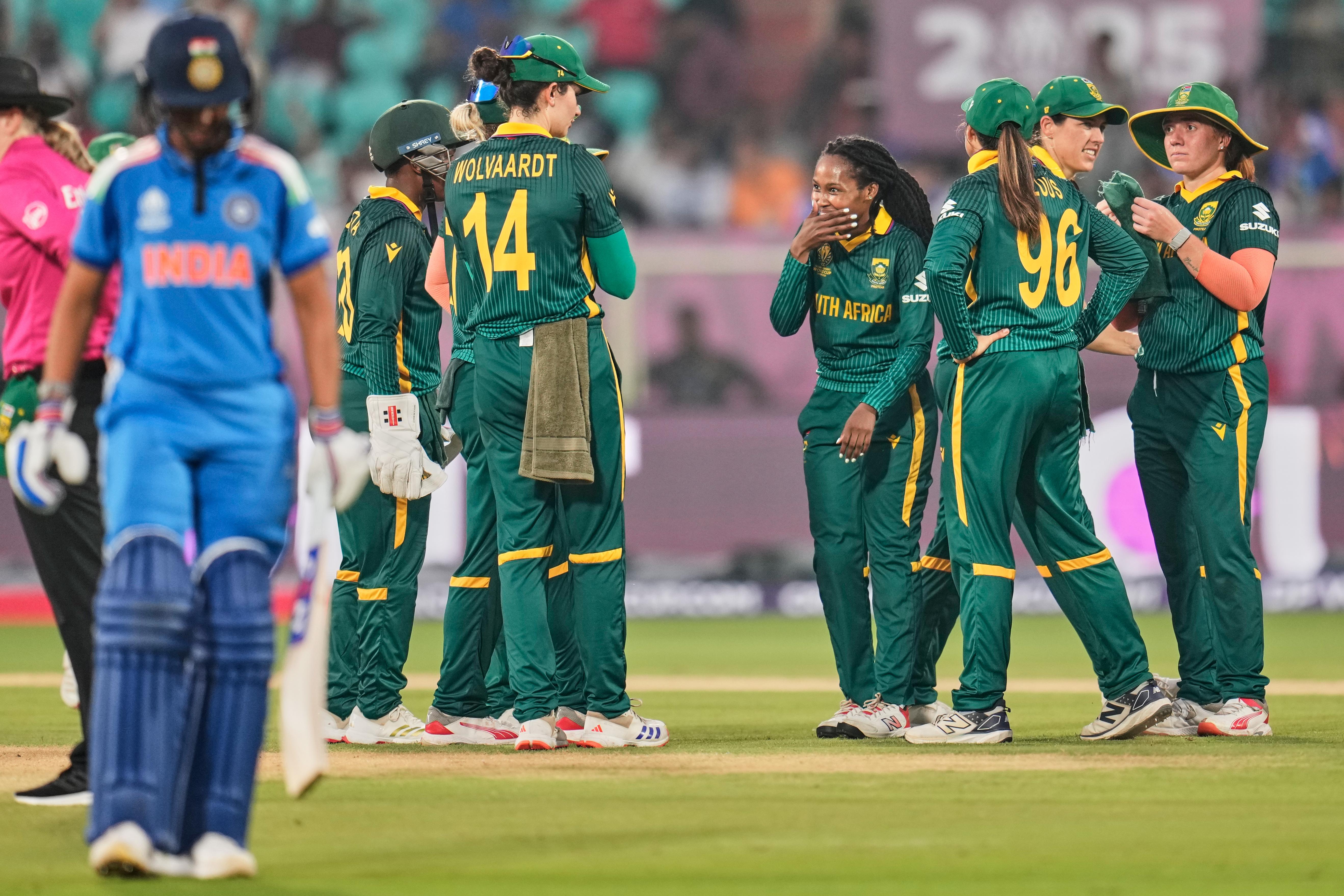 South Africa's Tumi Sekhukhune, center, celebrates with teammates after the dismissal of India's Pratika Rawal during the ICC Women's Cricket World Cup match between India and South Africa at ACA-VDCA Cricket Stadium in Visakhapatnam, India, Thursday, Oct. 9, 2025. (AP Photo/Aijaz Rahi)