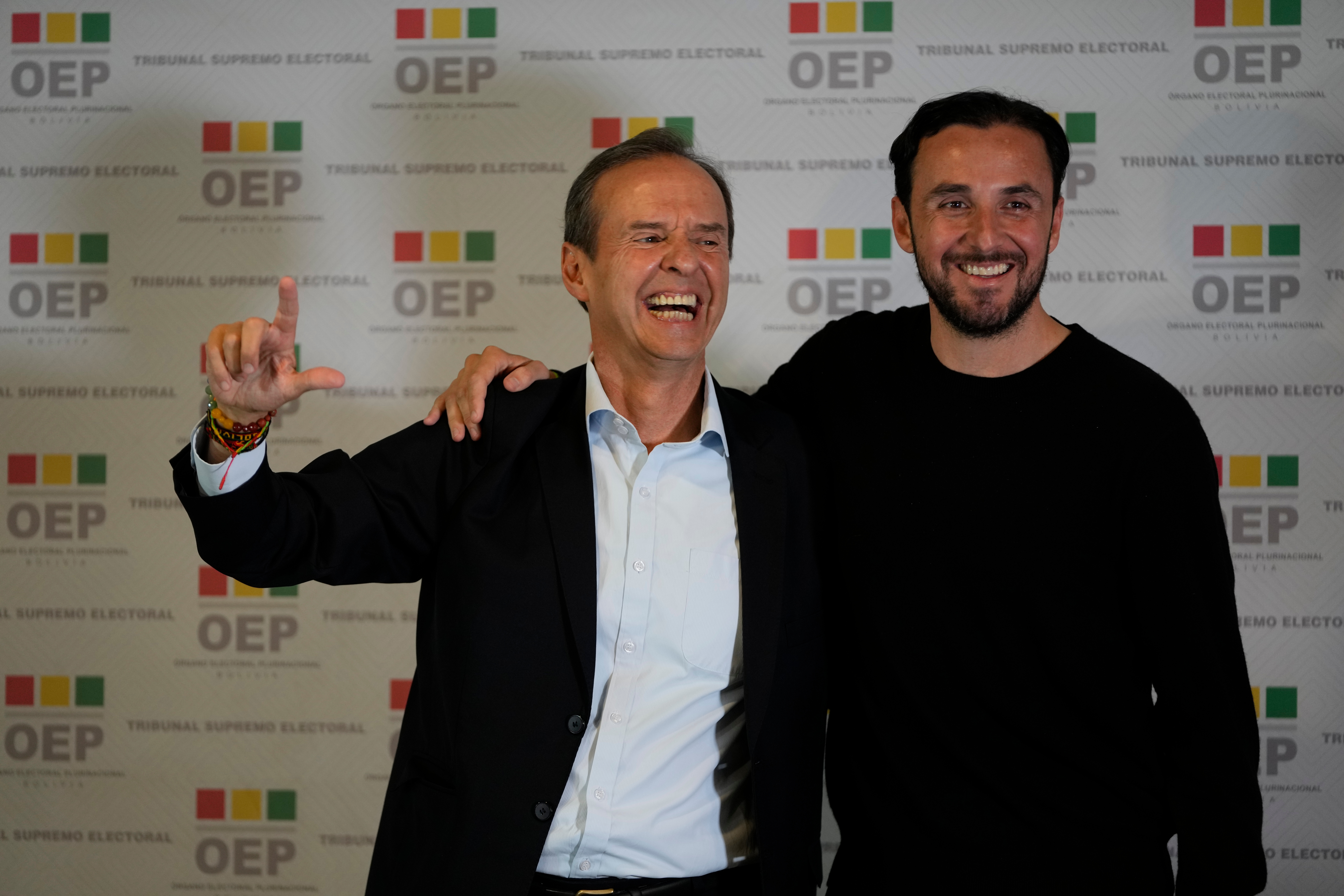 Jorge Quiroga and Juan Pablo Velasco stand together ahead of the presidential debate