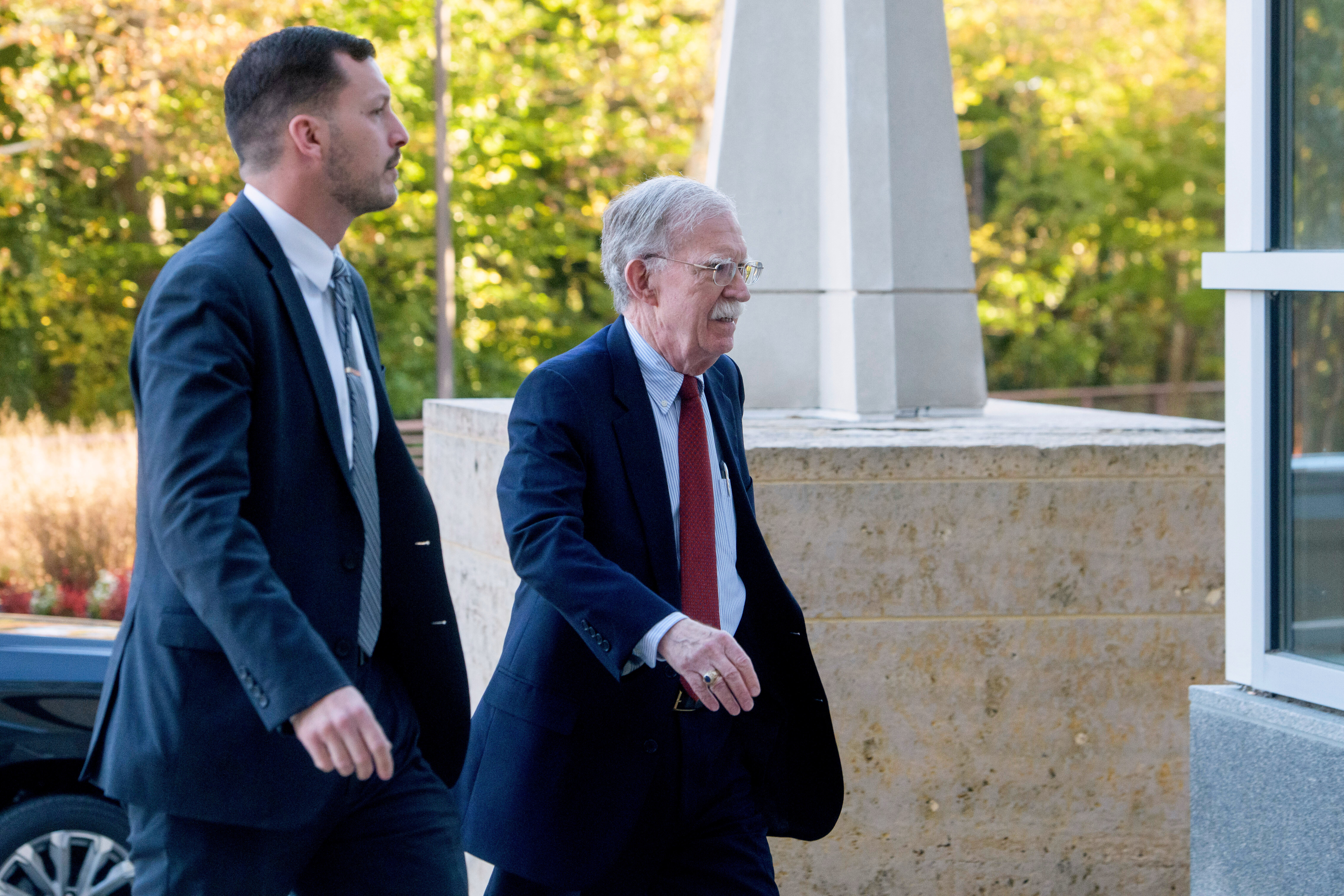 John Bolton arrives at a Maryland courthouse.