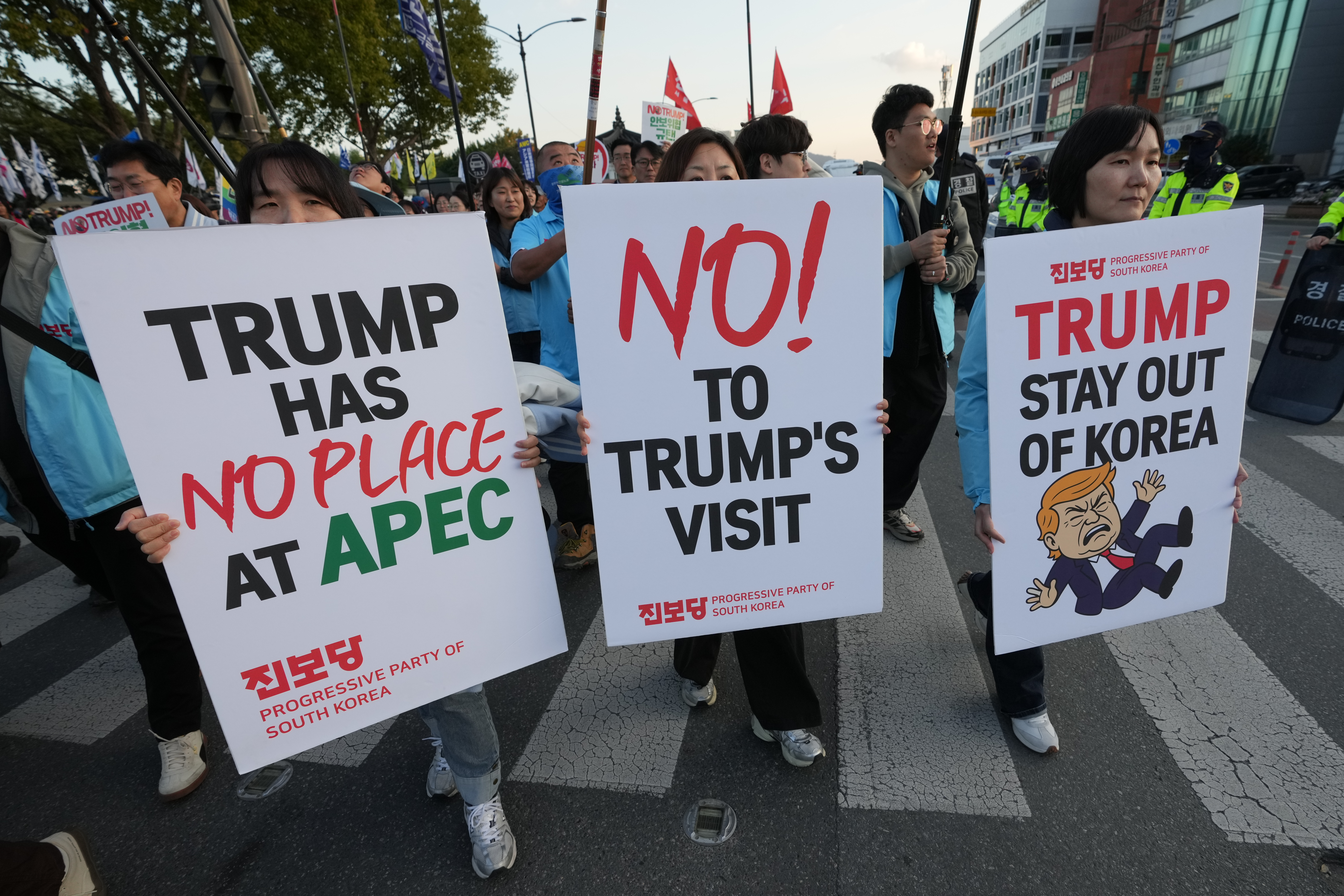 Demonstrators hold up anti-Trump signs in South Korea