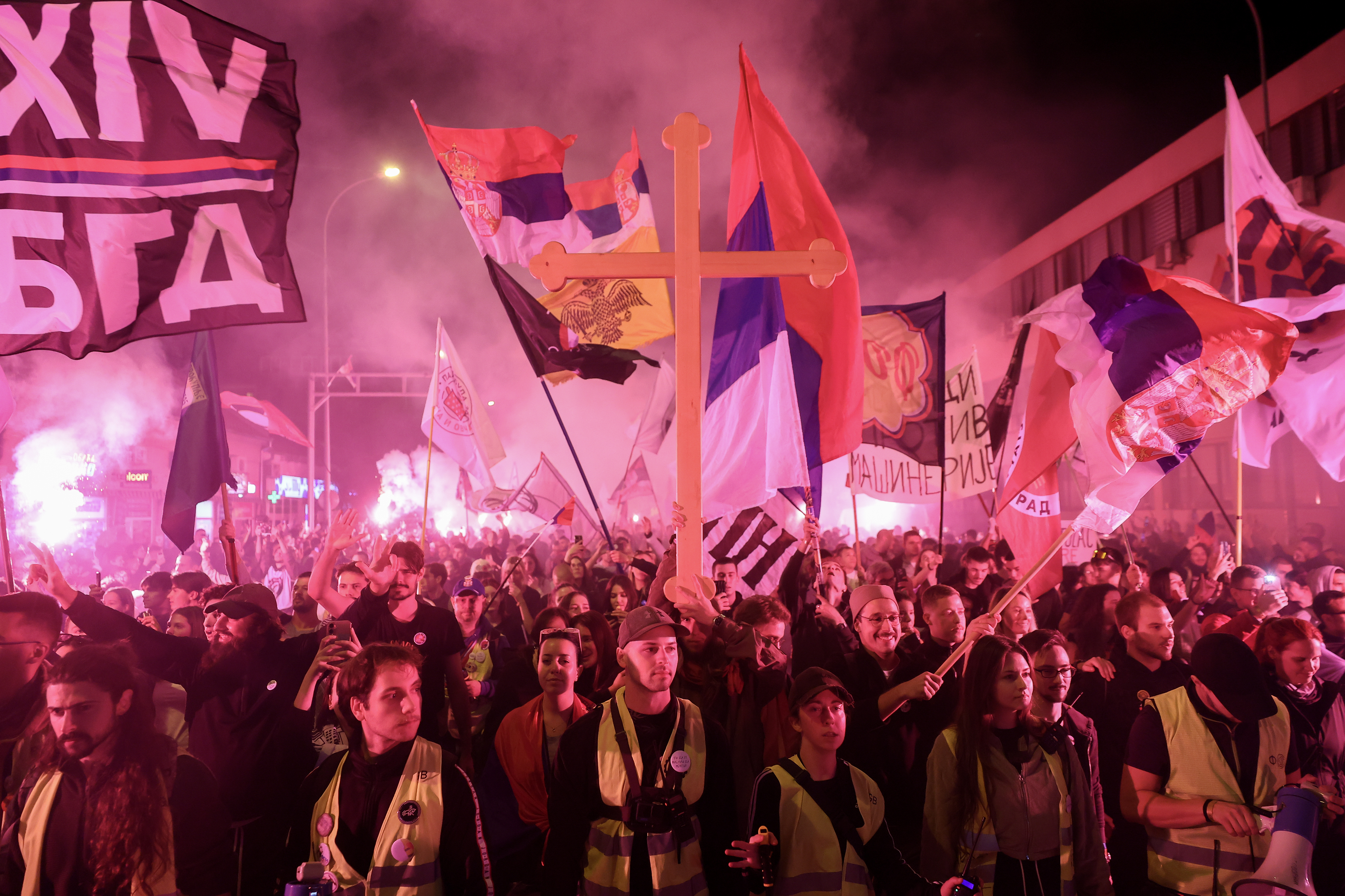 Students and antigovernment protesters marching.