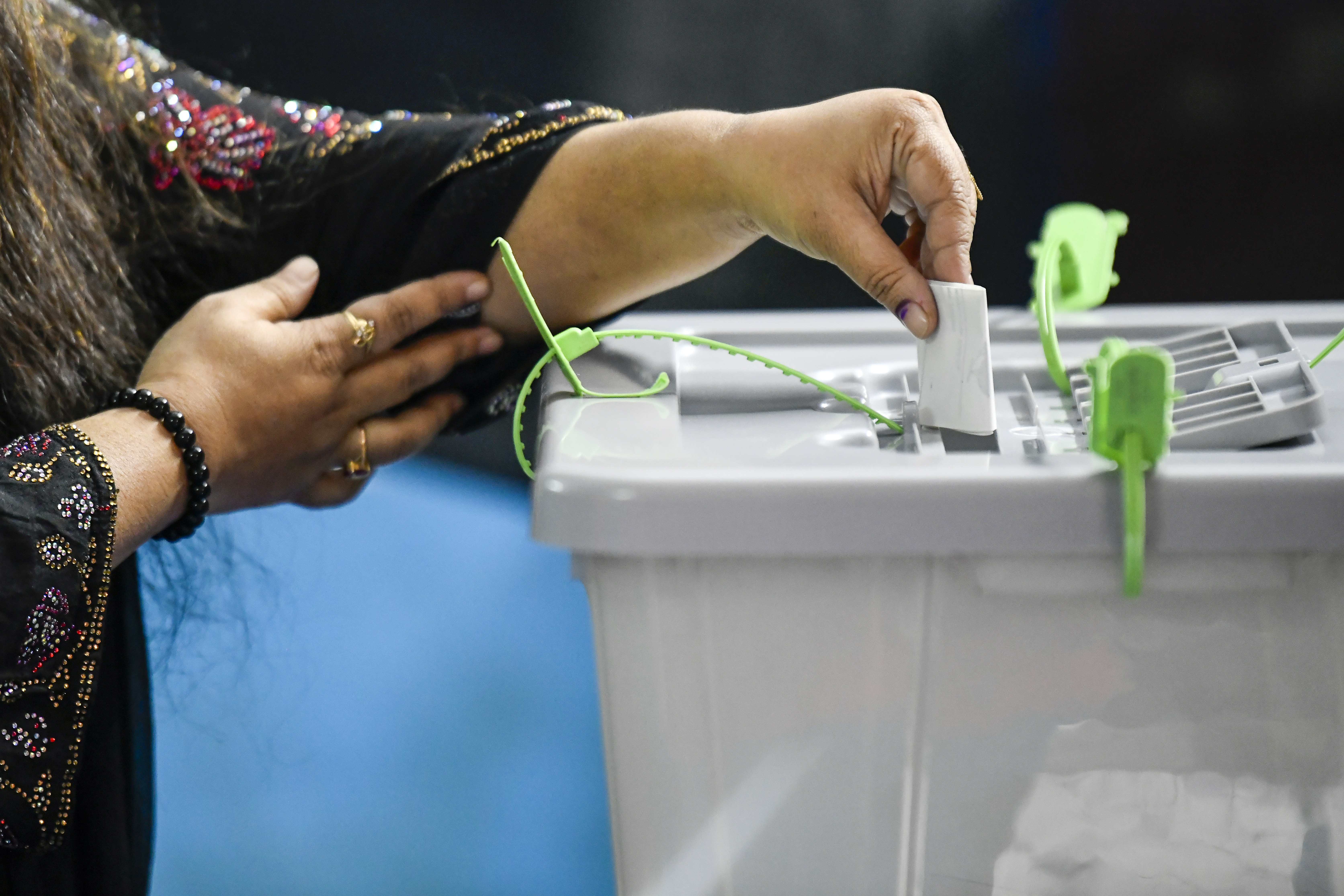 A woman casts her vote.