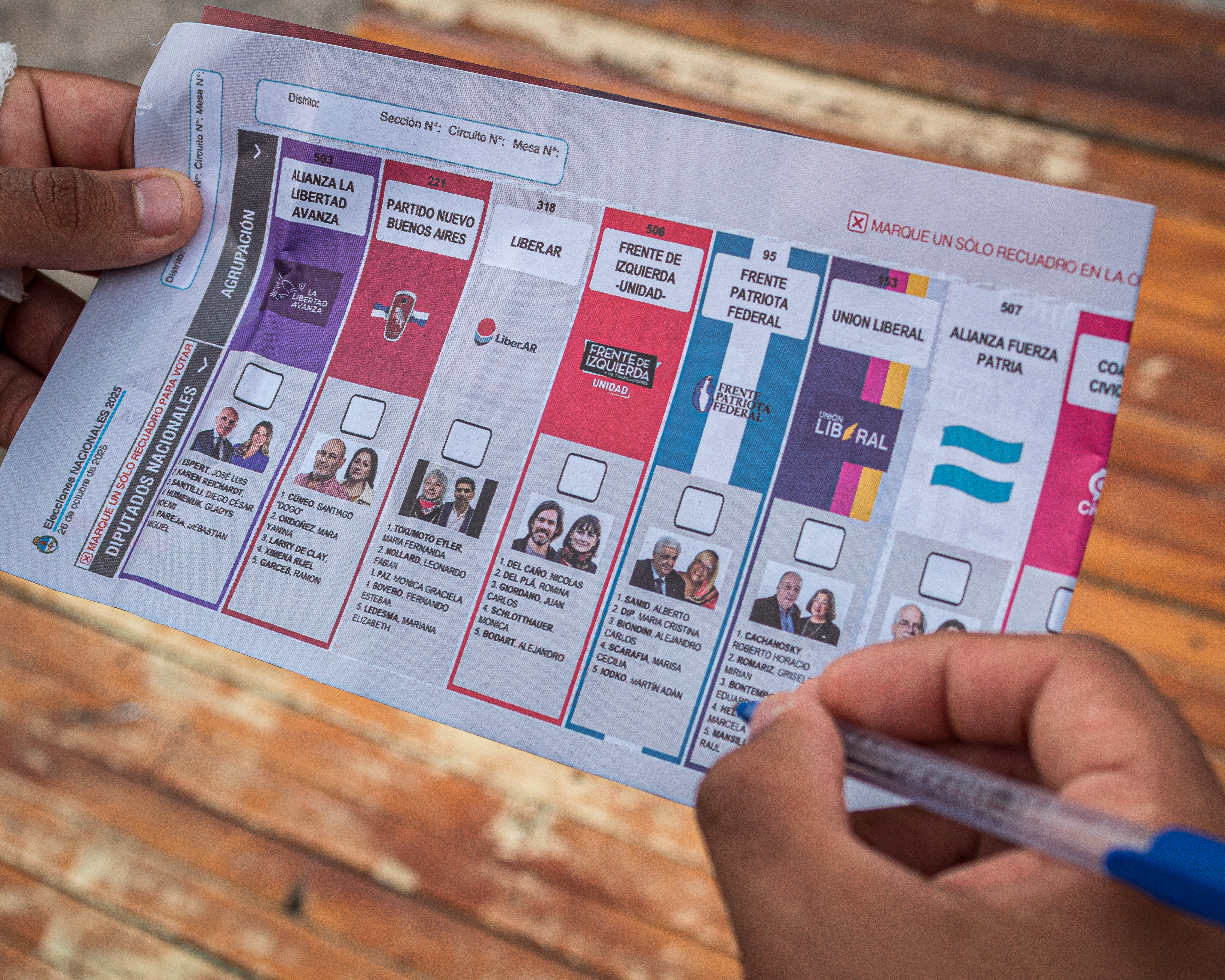 A person practices filling out the Argentina midterm ballot