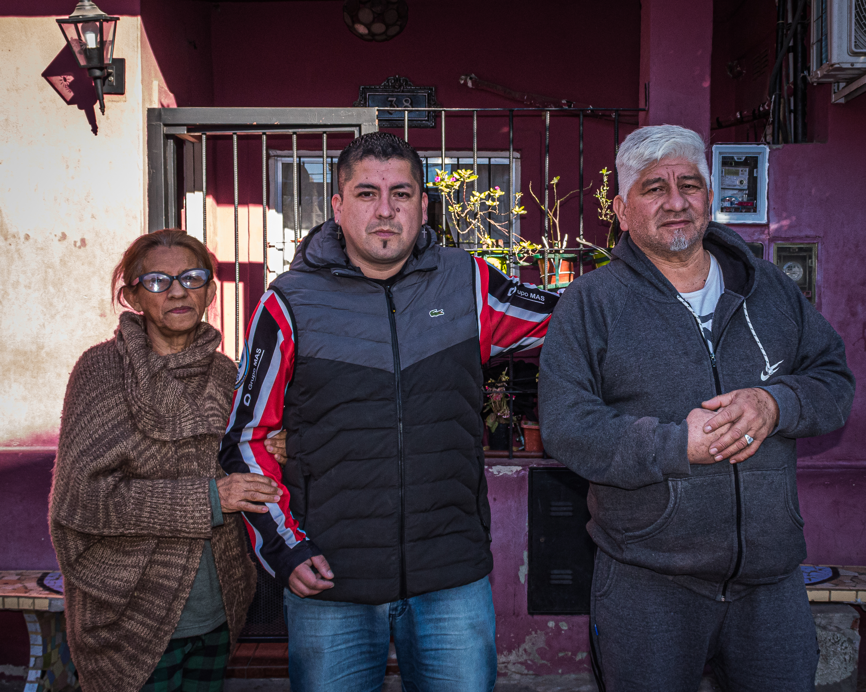 Jonathan Navarro with his mother and father on either side of him