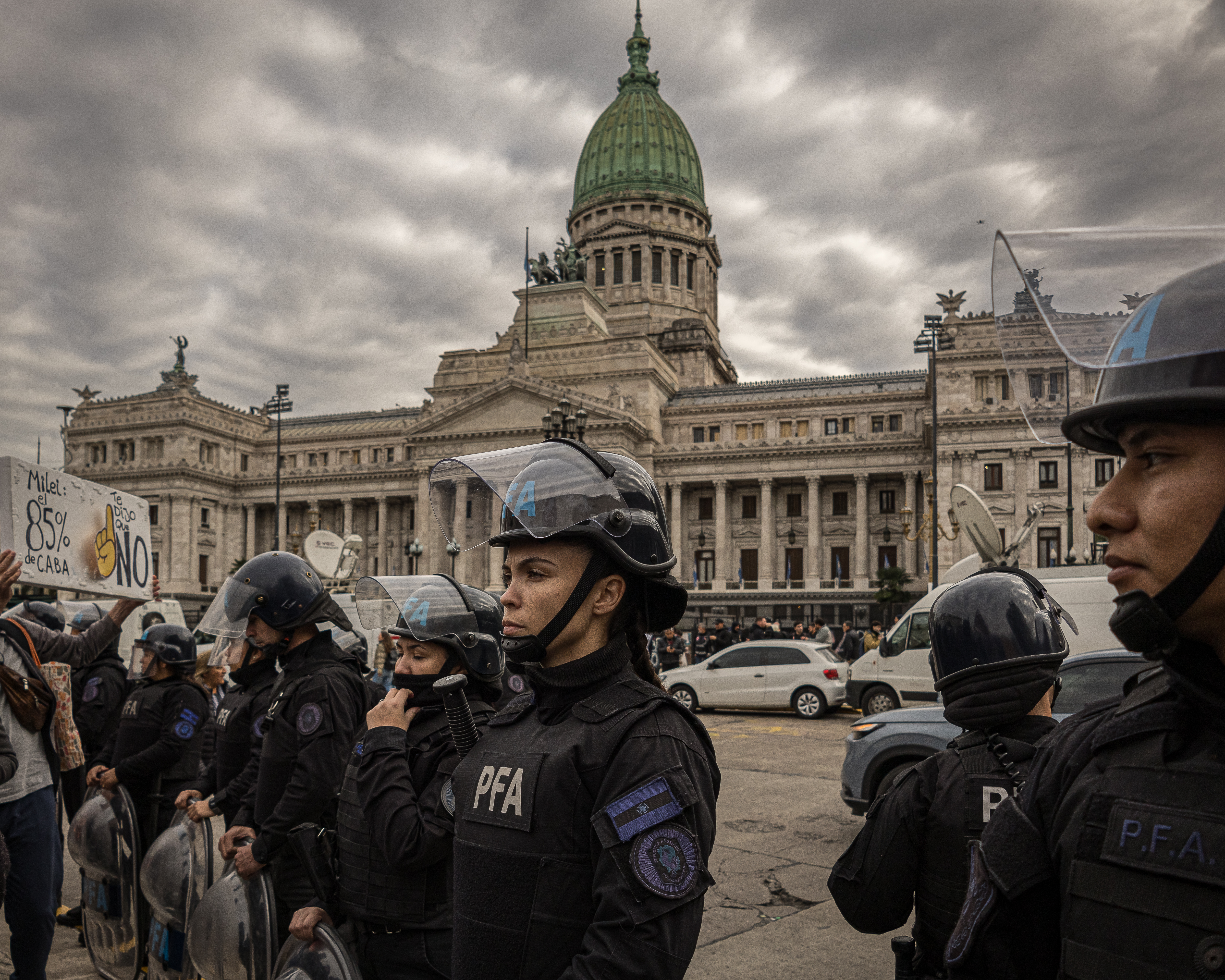 Police in riot gear stand in front of Argentina's Congress