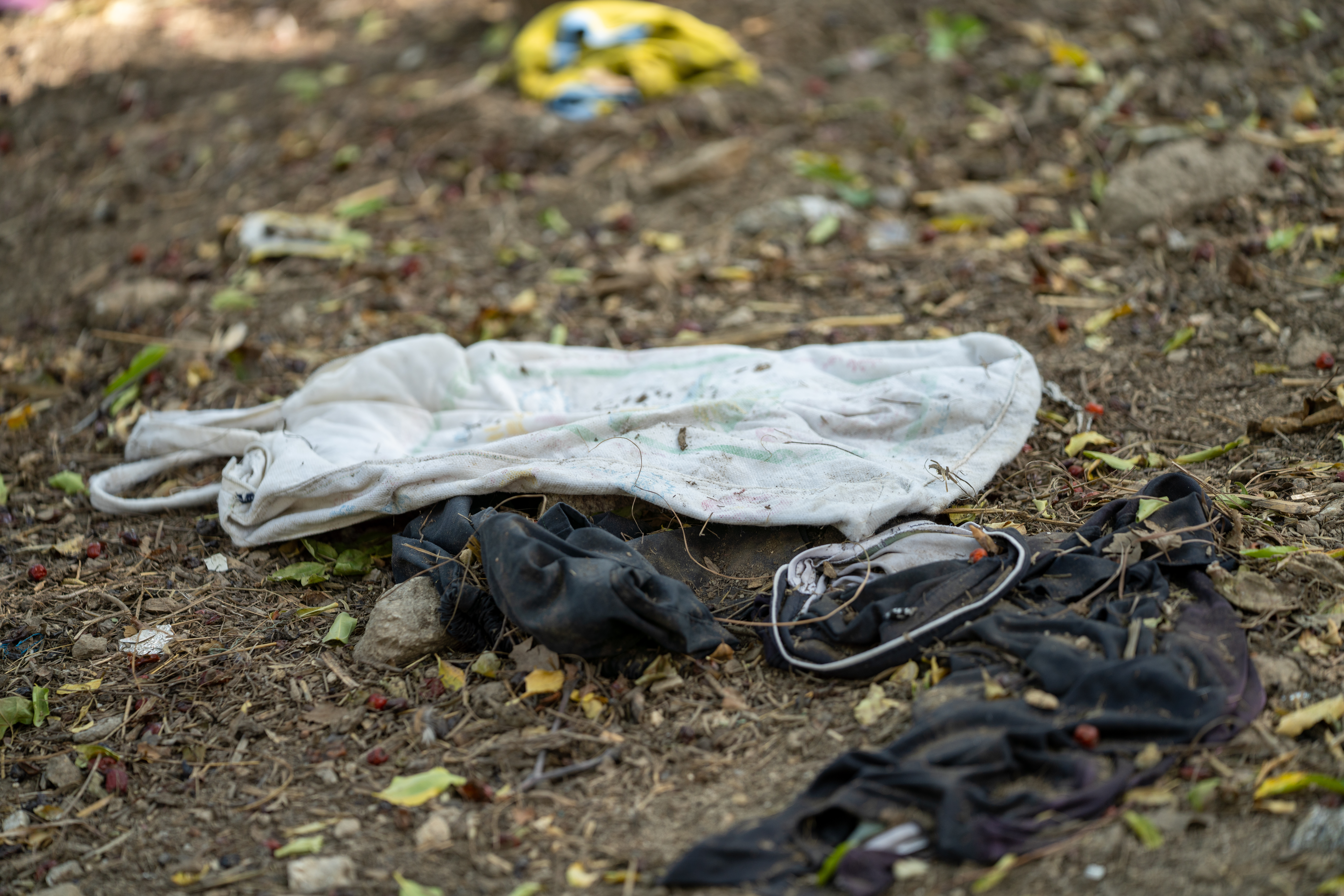 Children's clothes left on the ground following the earthquake [Sorin Furcoi/Al Jazeera]