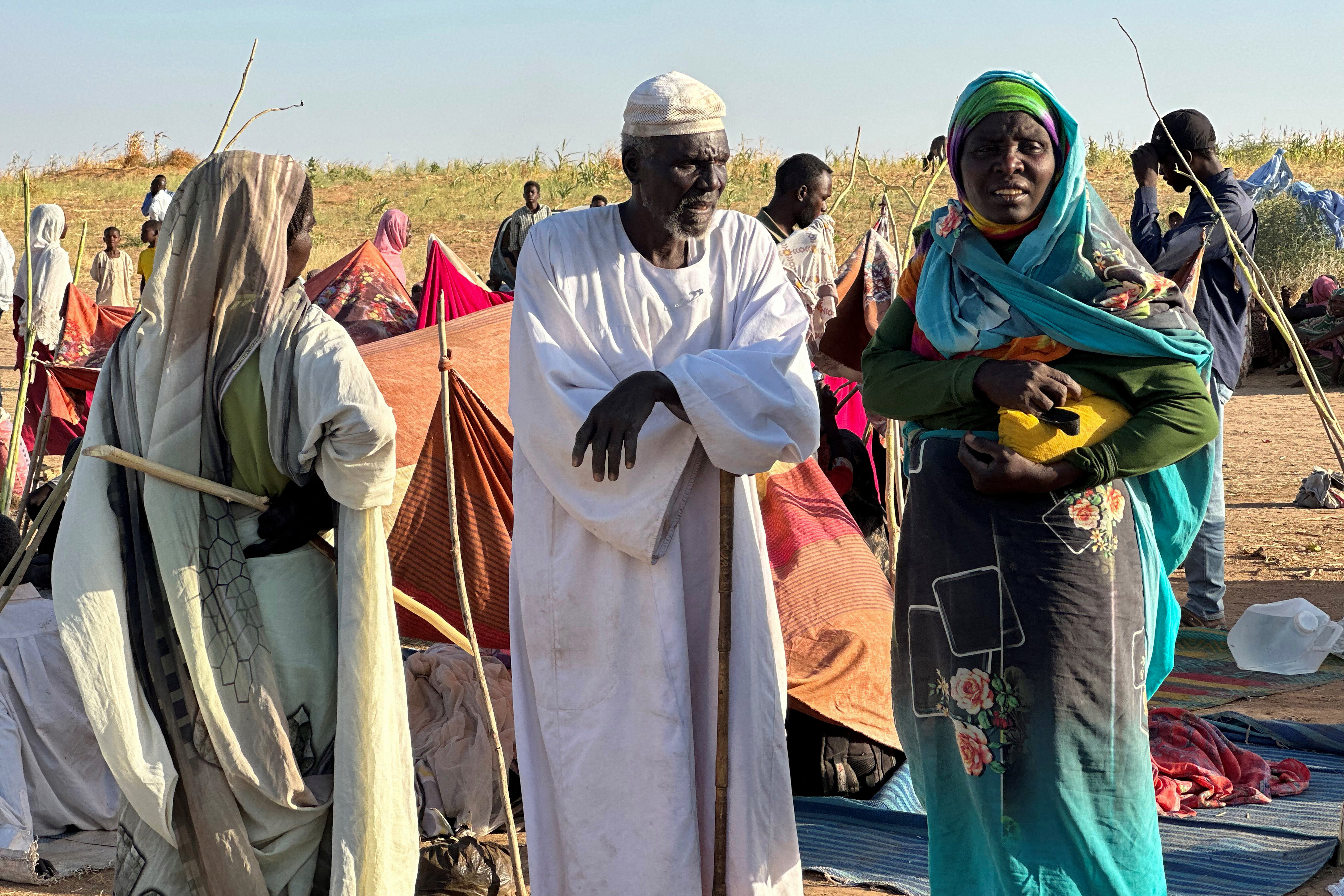 Displaced Sudanese who fled El-Fasher after the city fell to the Rapid Support Forces (RSF), arrive in the town of Tawila in war-torn Sudan's western Darfur region on October 28, 2025.