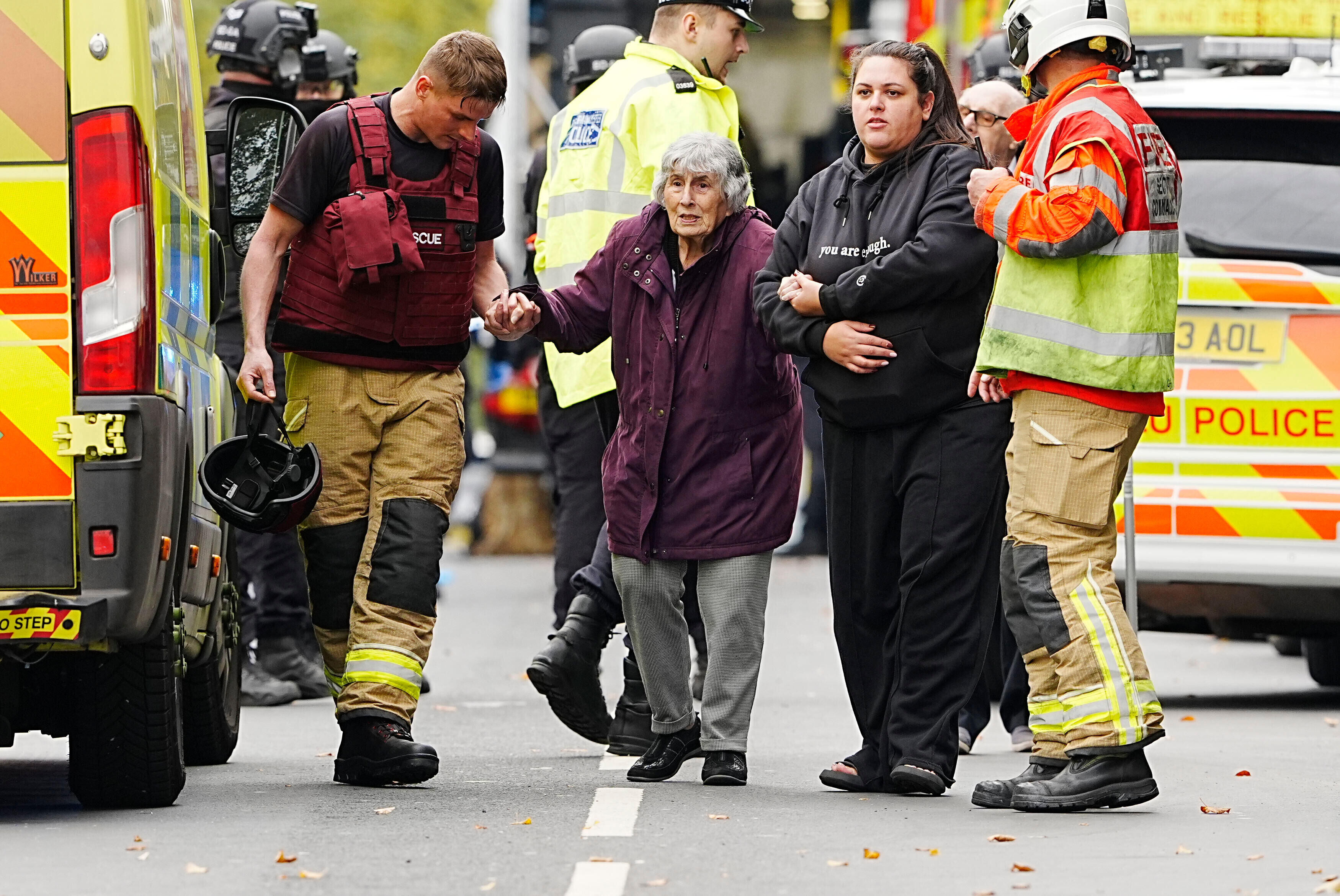 A member of the public is helped from the scene of a stabbing incident at Heaton Park Hebrew Congregation synagogue, in Crumpsall, Manchester, England, Thursday Oct. 2, 2025. (Peter Byrne/PA via AP)