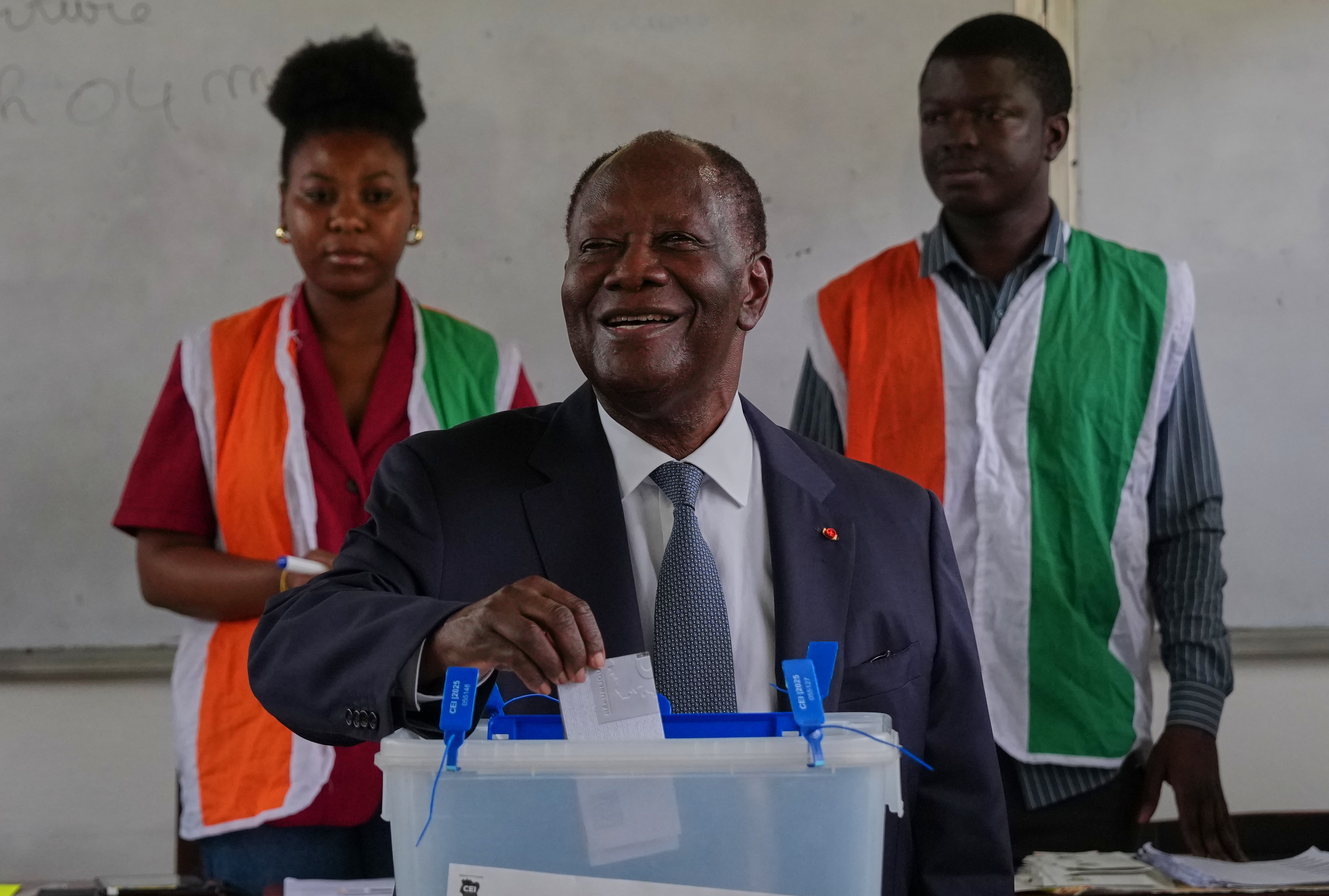 Ivory Coast President Alassane Ouattara casts his vote at a polling station during the presidential elections in Abidjan, Ivory Coast, Saturday, Oct. 25, 2025. (AP Photo/Misper Apawu)