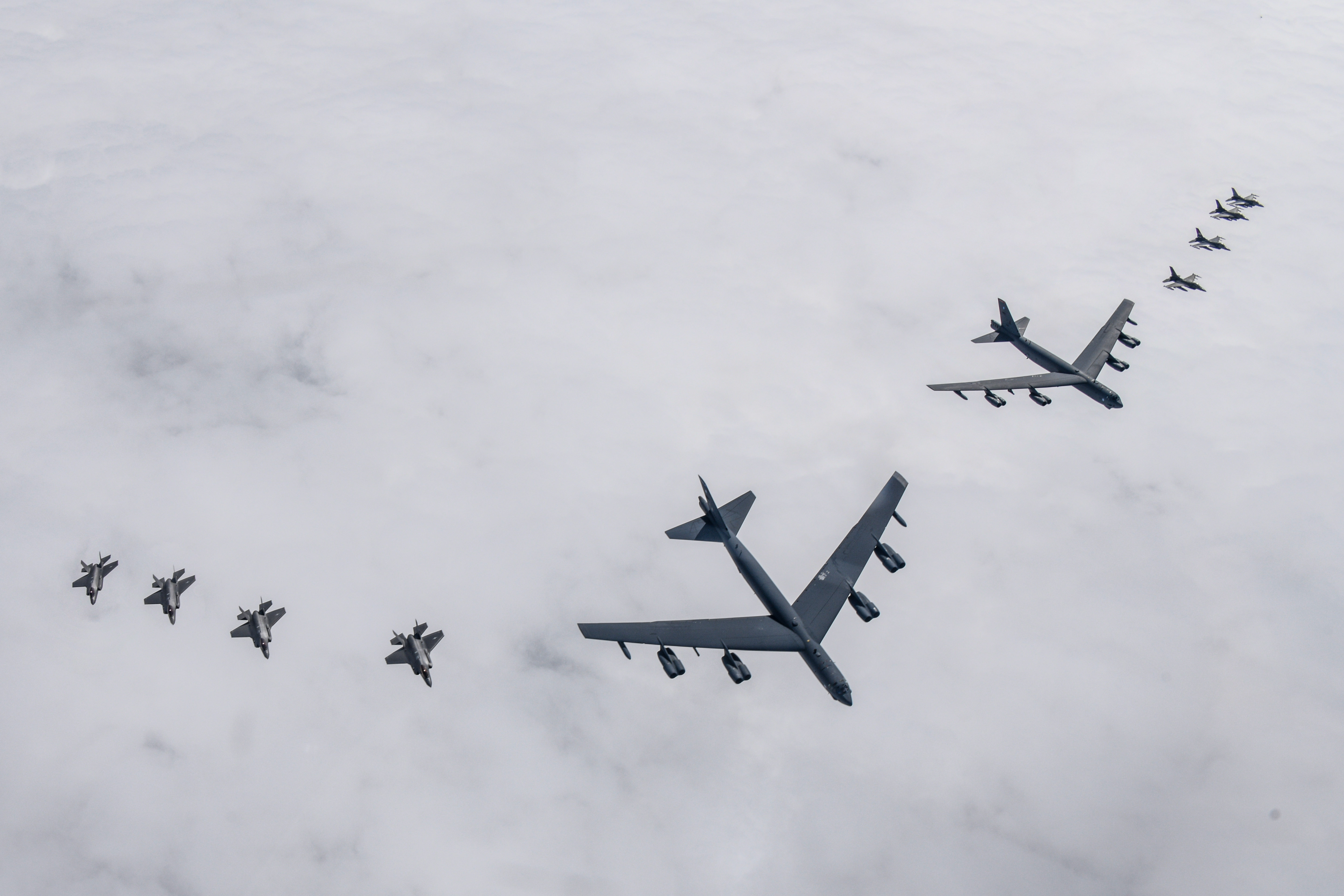 UNDISCLOSED LOCATION, SOUTH KOREA - APRIL 14: In this handout image released by the South Korean Defense Ministry, two U.S. Air Force B-52H strategic bombers (C) flying with South Korean Air Force F-35A (L) and U.S. Air Force F-16 (R) fighter jets during a joint air drill on April 14, 2023 at an undisclosed location in South Korea. South Korea and the United States held joint air drills, involving at least one B-52H strategic bomber, a day after North Korea test-fired a new intercontinental ballistic missile (ICBM). (Photo by South Korean Defense Ministry via Getty Images)
