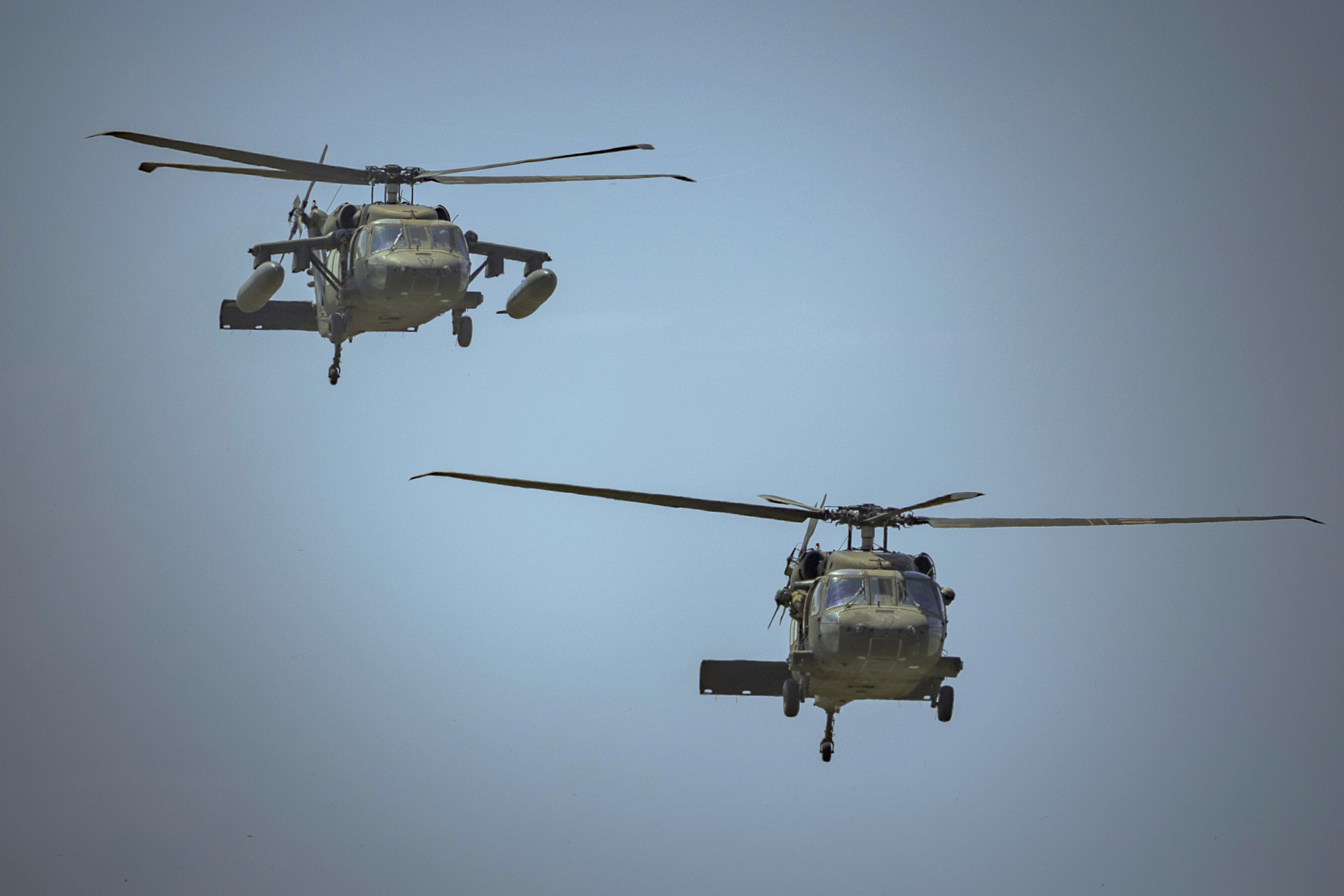 APARRI, PHILIPPINES - MAY 03: Black Hawk helicopters fly in formation during a counter landing live fire exercise at a beach as part of U.S.-Philippines joint military exercises on May 03, 2025 in Aparri, Cagayan province, Philippines. More than 14,000 Filipino and U.S. troops are taking part in this year's Balikatan, or "shoulder-to-shoulder," exercises, billed as the "Super Bowl" of military drills in the region. The exercises focus on a "full battle test" between the two defense treaty allies amid heightened security tensions. This year’s deployment of missile systems within firing range of waters near Taiwan and the South China Sea has drawn criticism from China, which called the drills provocative. (Photo by Ezra Acayan/Getty Images)