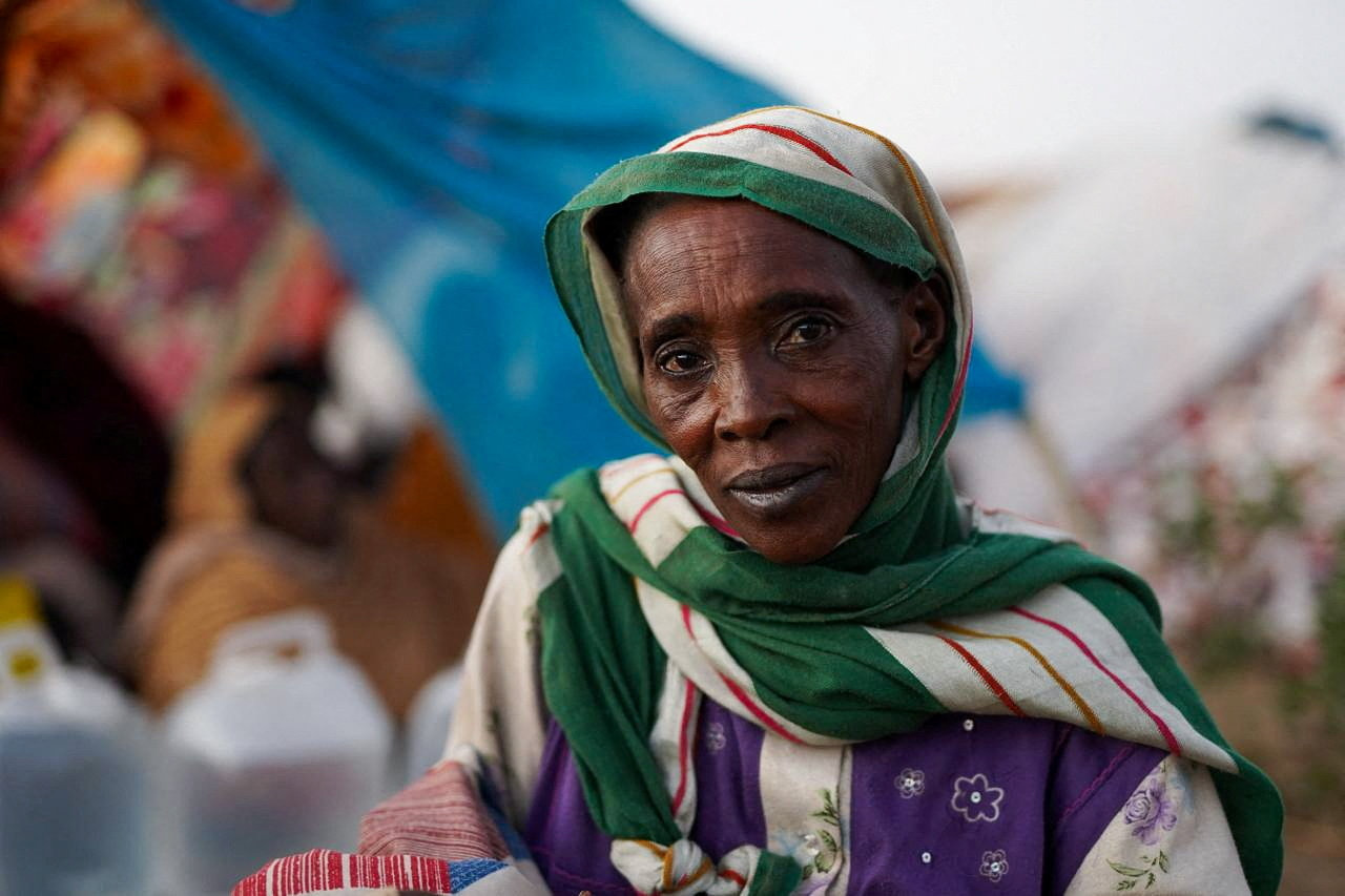 The grandmother of Ikram Abdelhameed looks on while sitting at a camp for displaced people who fled from al-Fashir to Tawila, North Darfur, Sudan, October 27, 2025. REUTERS/Mohammed Jamal
