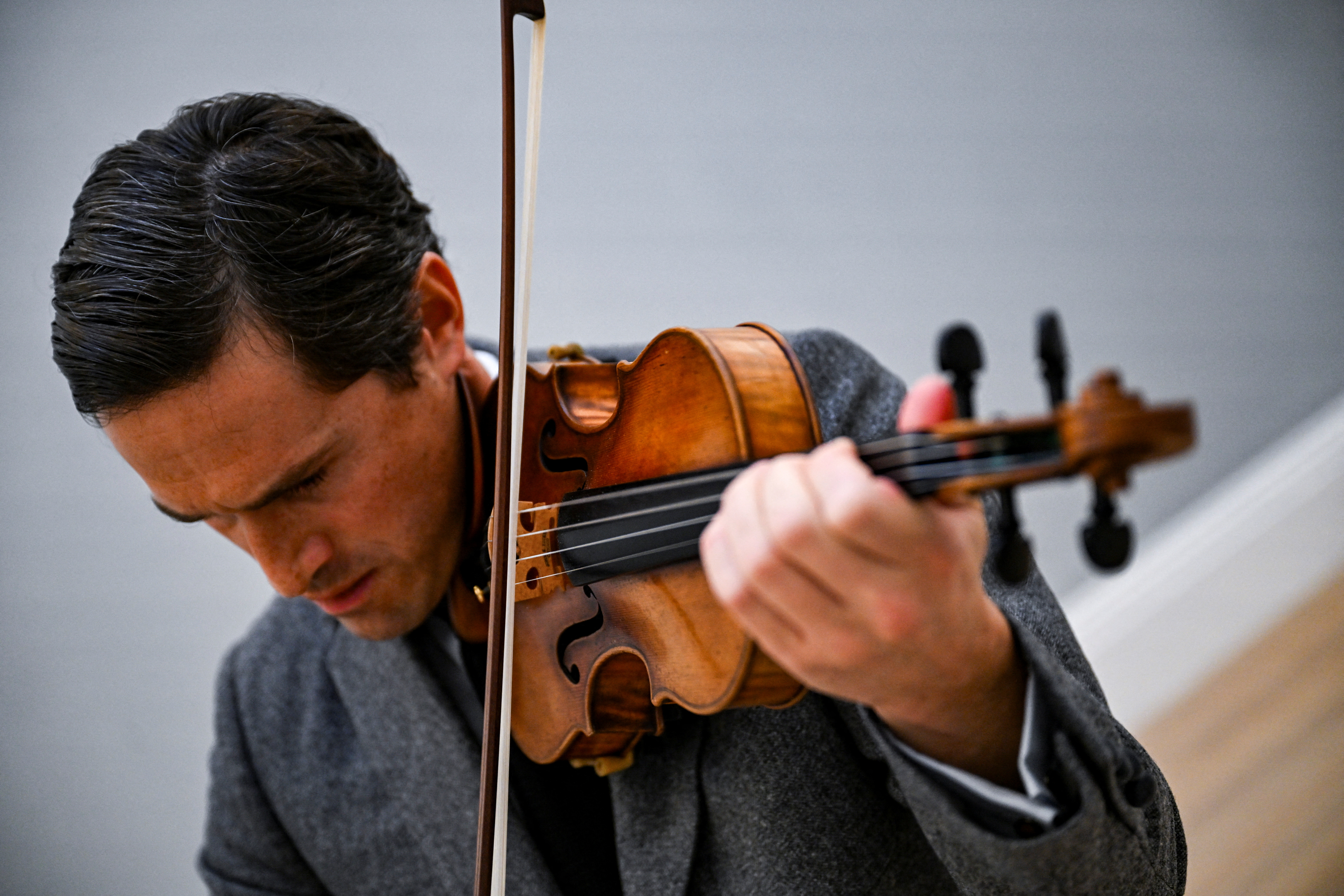 A violinist plays a Stradivarius violin.