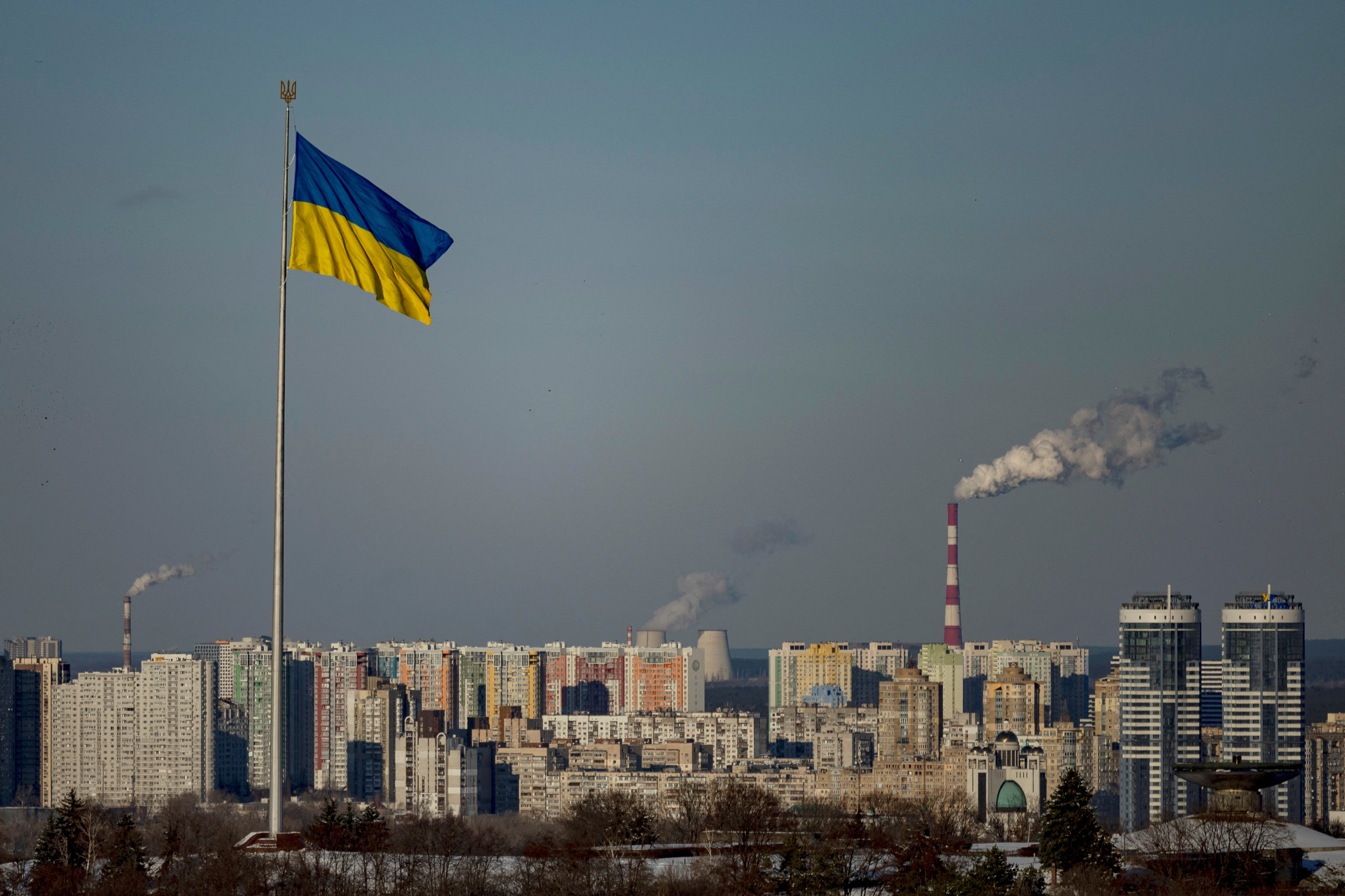The Ukrainian national flag flies over the city, amid Russia’s attack on Ukraine, in central Kyiv, Ukraine, February 17, 2025. REUTERS/Thomas Peter