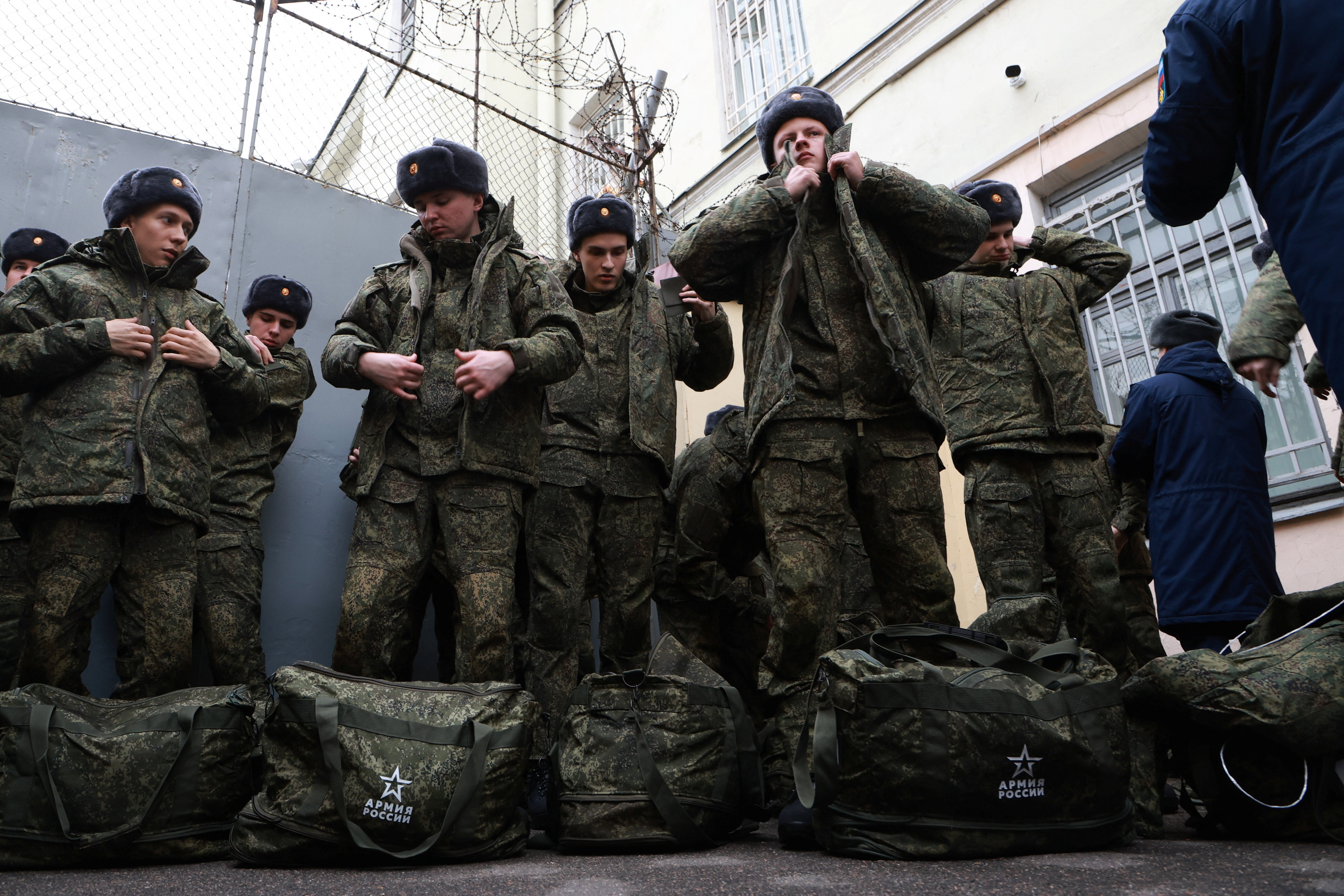 Russian conscripts called up for military service attend a ceremony marking their departure for garrisons from a recruitment centre in Saint Petersburg, Russia, on October 15, 2025 [Anton Vaganov/Reuters]