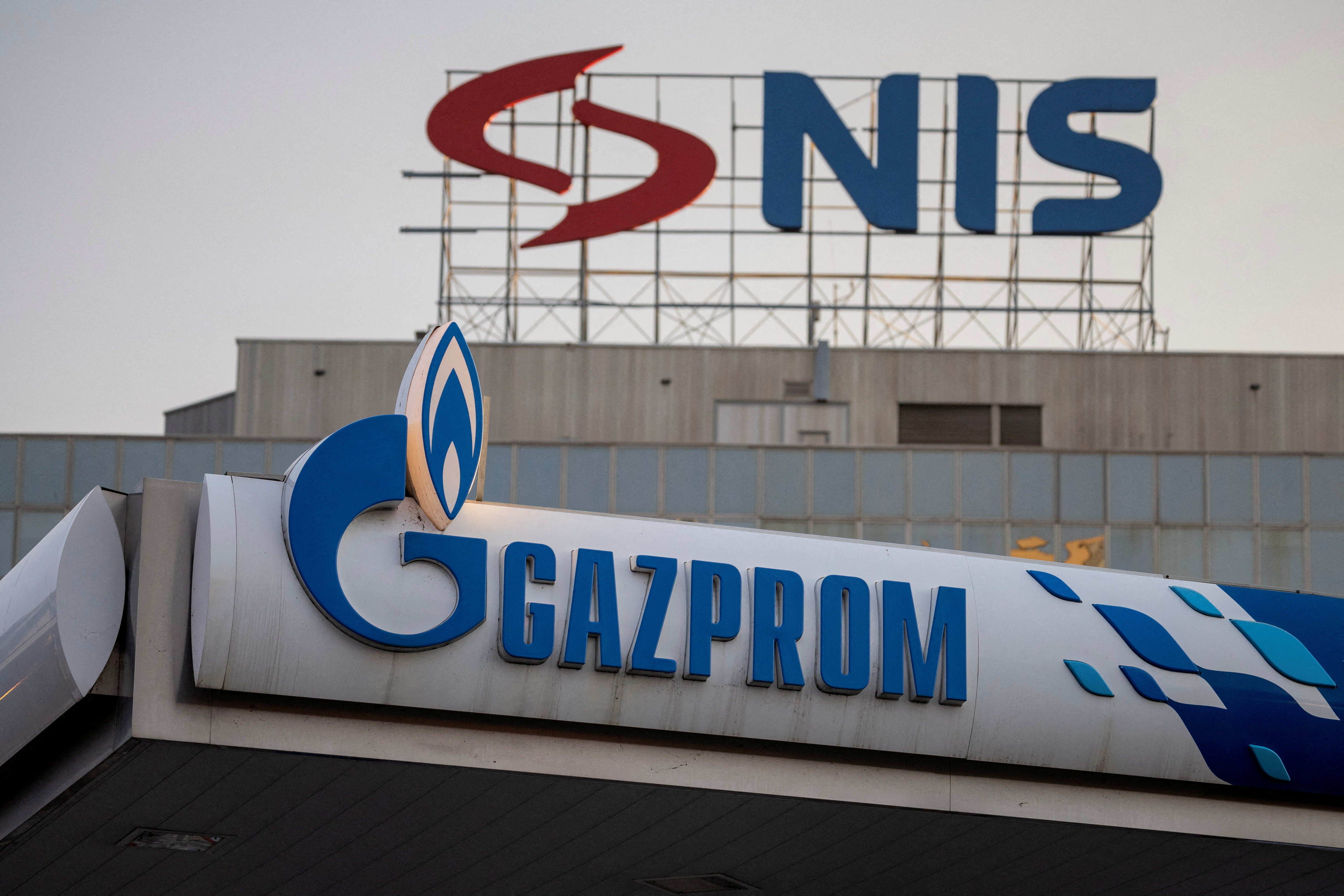 Signs display the logos of Serbia&rsquo;s Naftna Industrija Srbije (NIS) and Russia's oil producer Gazprom Neft, in Belgrade, Serbia on October 8, 2025 [File: Marko Djurica/Reuters]