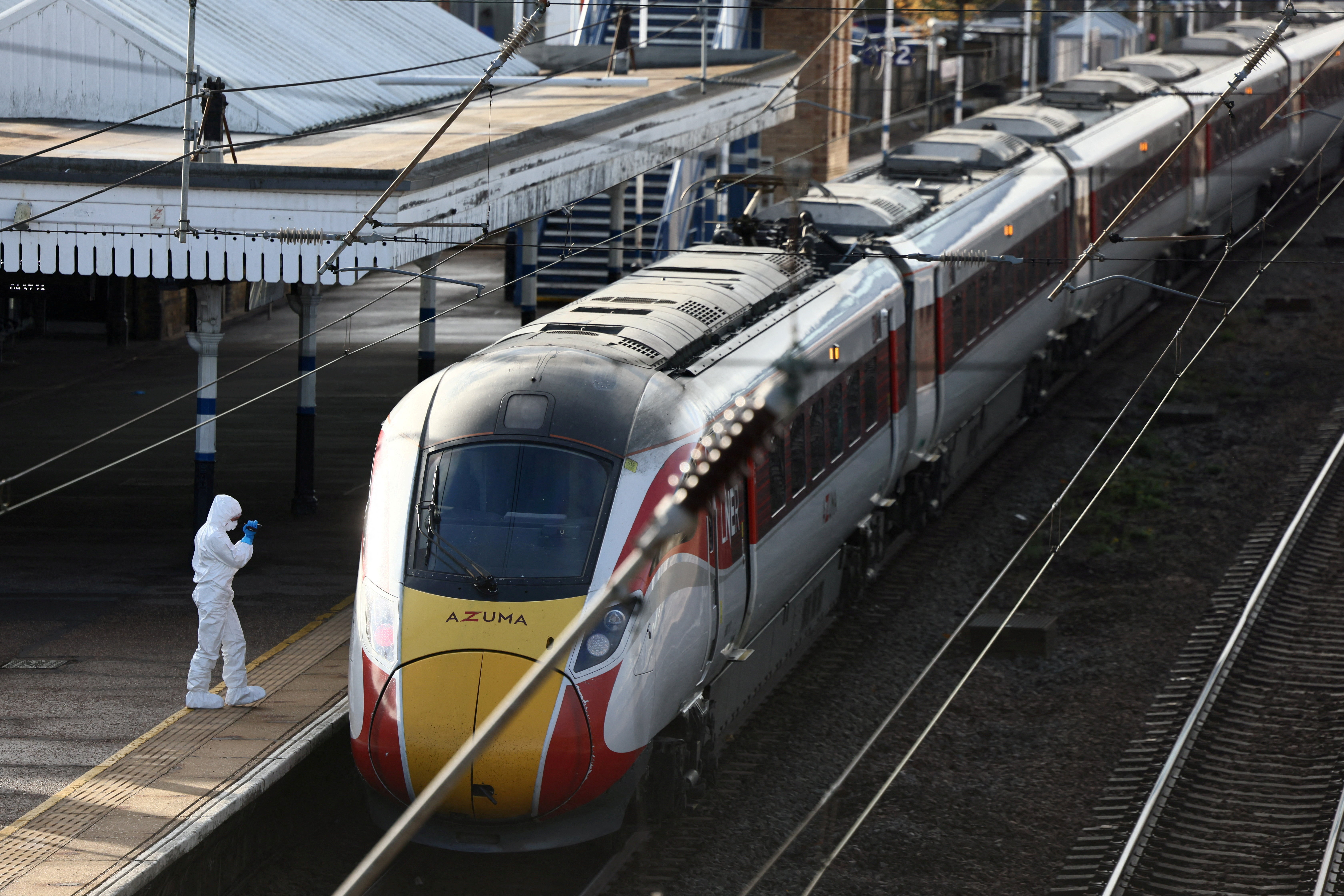 A forensic officer inspects the London North Eastern Railway (LNER) train where a series of stabbings took place