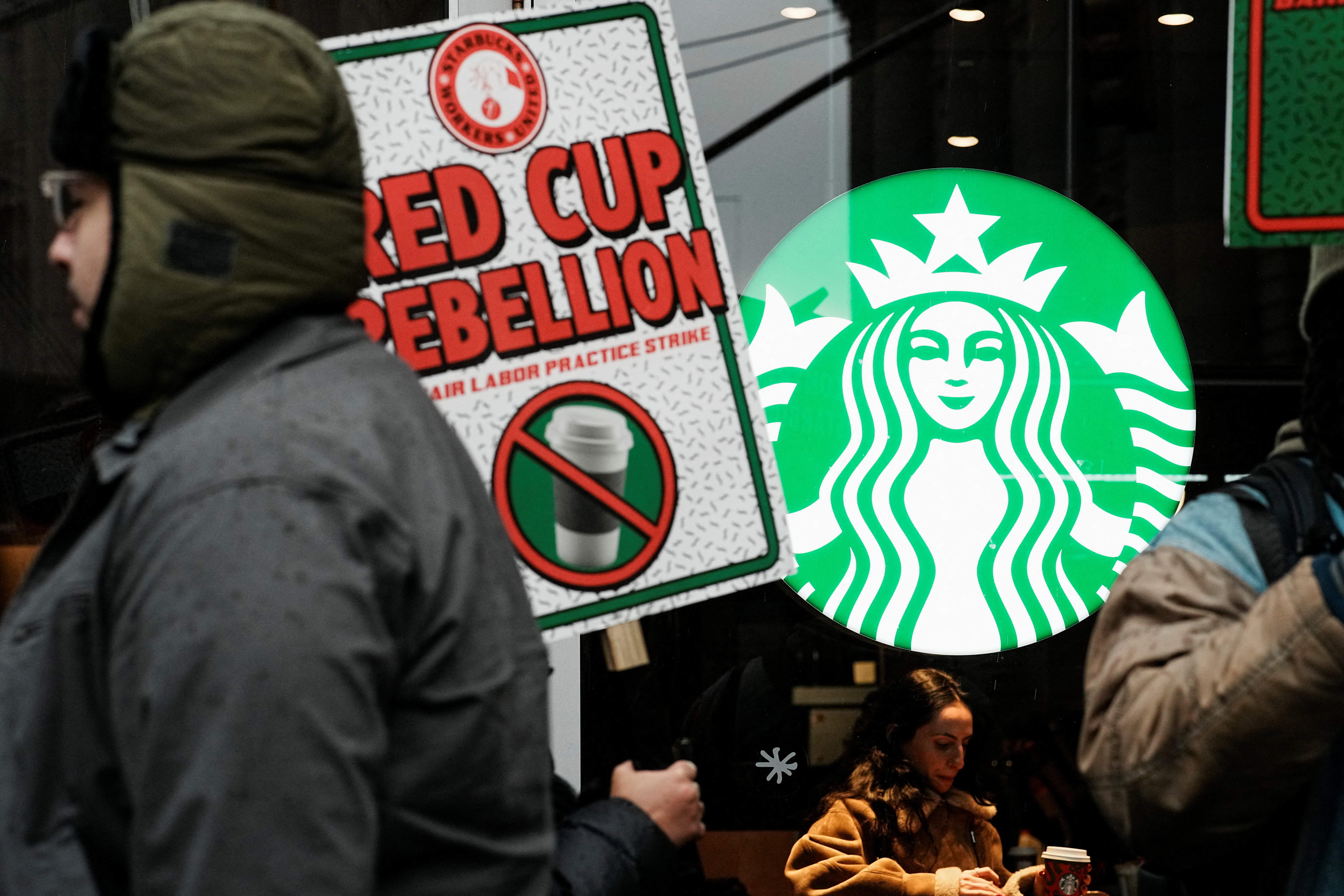 The union is also calling on consumers to boycott Starbucks stores [Eduardo Munoz/Reuters]