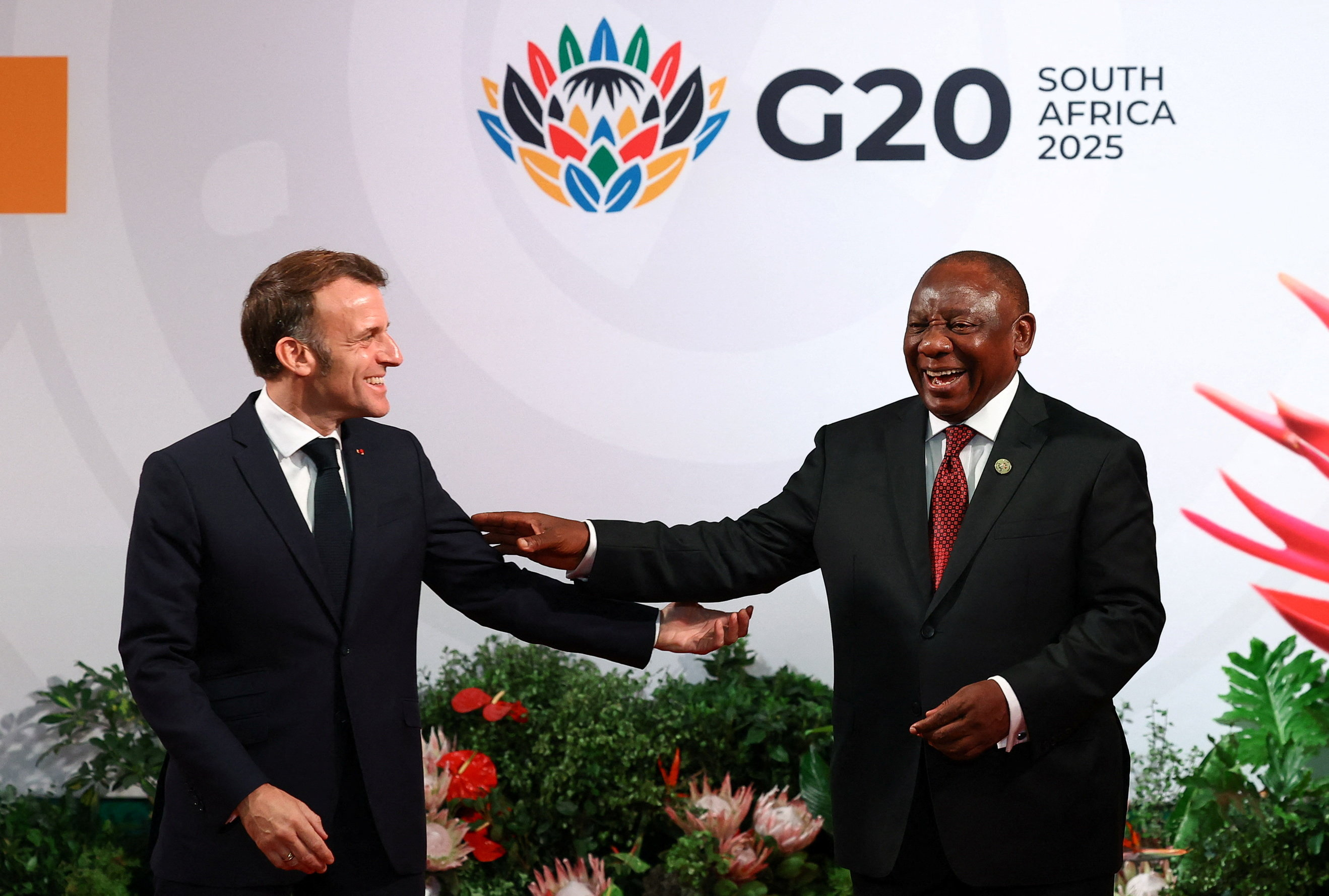 France's President Emmanuel Macron is greeted by South Africa's President Cyril Ramaphosa