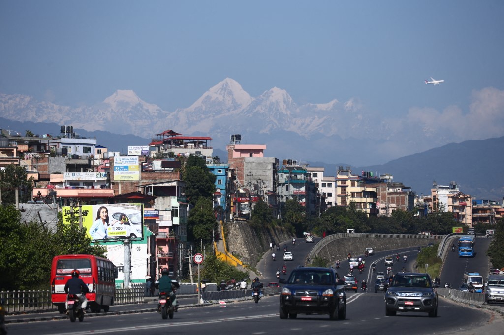 With the skies clearing over the Kathmandu Valley in Kathmandu, Nepal, on October 21, 2025, majestic Himalayan peaks become visible from various parts of the city, offering residents a view after days of crisp, pollution-free weather. (Photo by Sanjit Pariyar/NurPhoto) (Photo by Sanjit Pariyar / NurPhoto / NurPhoto via AFP)