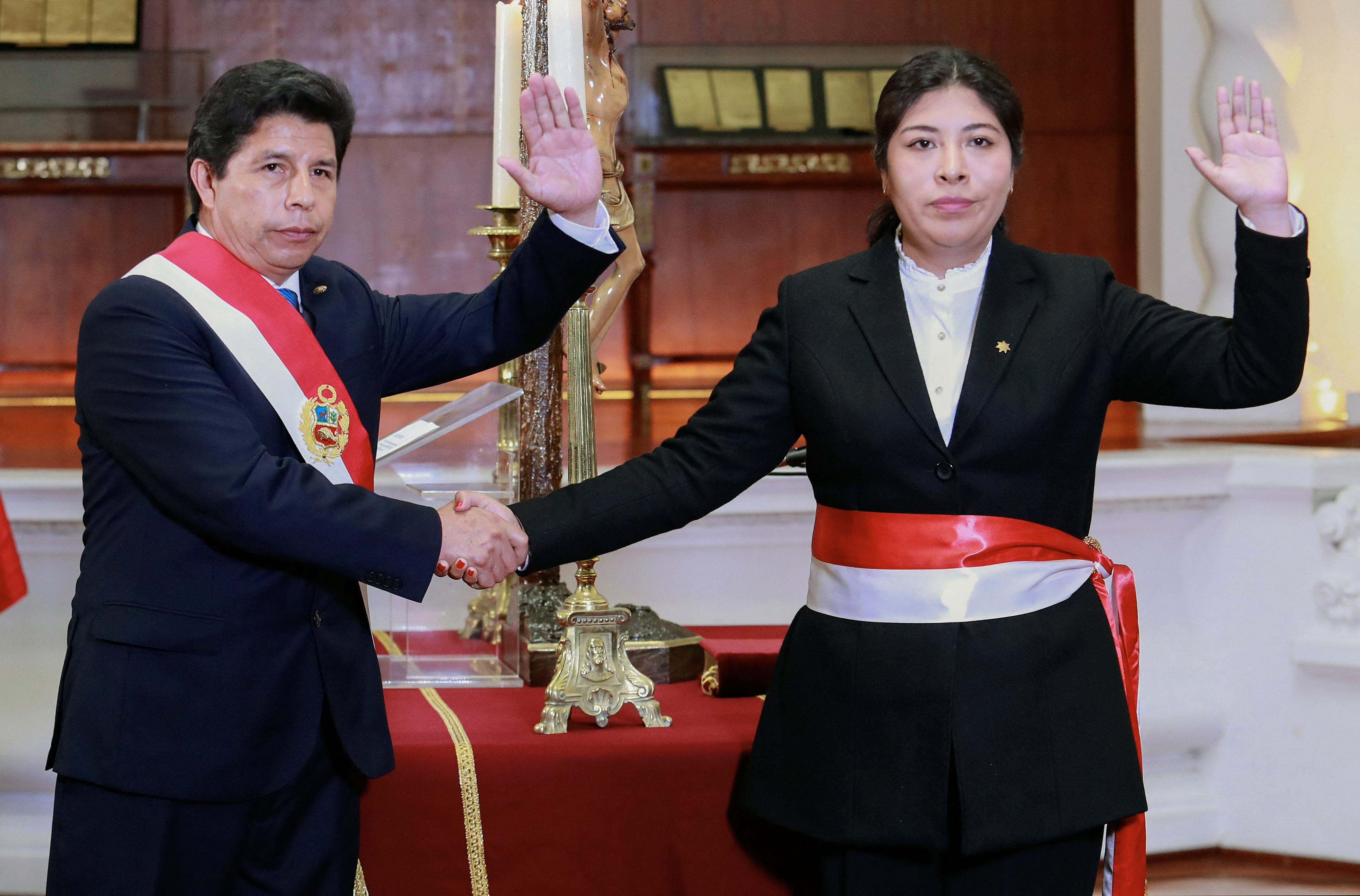 his handout picture released by the Peruvian Presidency on November 25, 2022 shows then Peruvian President Pedro Castillo (L) swearing in Betssy Chavez (R) as Prime Minister, in Lima.