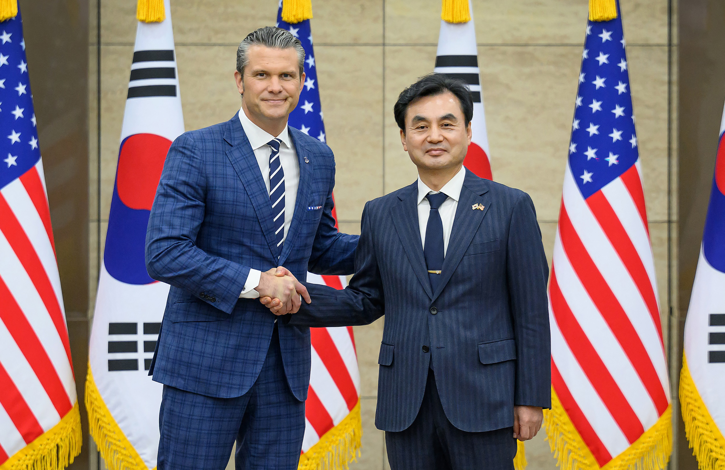 US Defence Secretary Pete Hegseth (L) shakes hands with South Korean Defence Minister Ahn Gyu-back (R) during the 57th Security Consultative Meeting at the Defence Ministry in Seoul, South Korea on November 4, 2025.