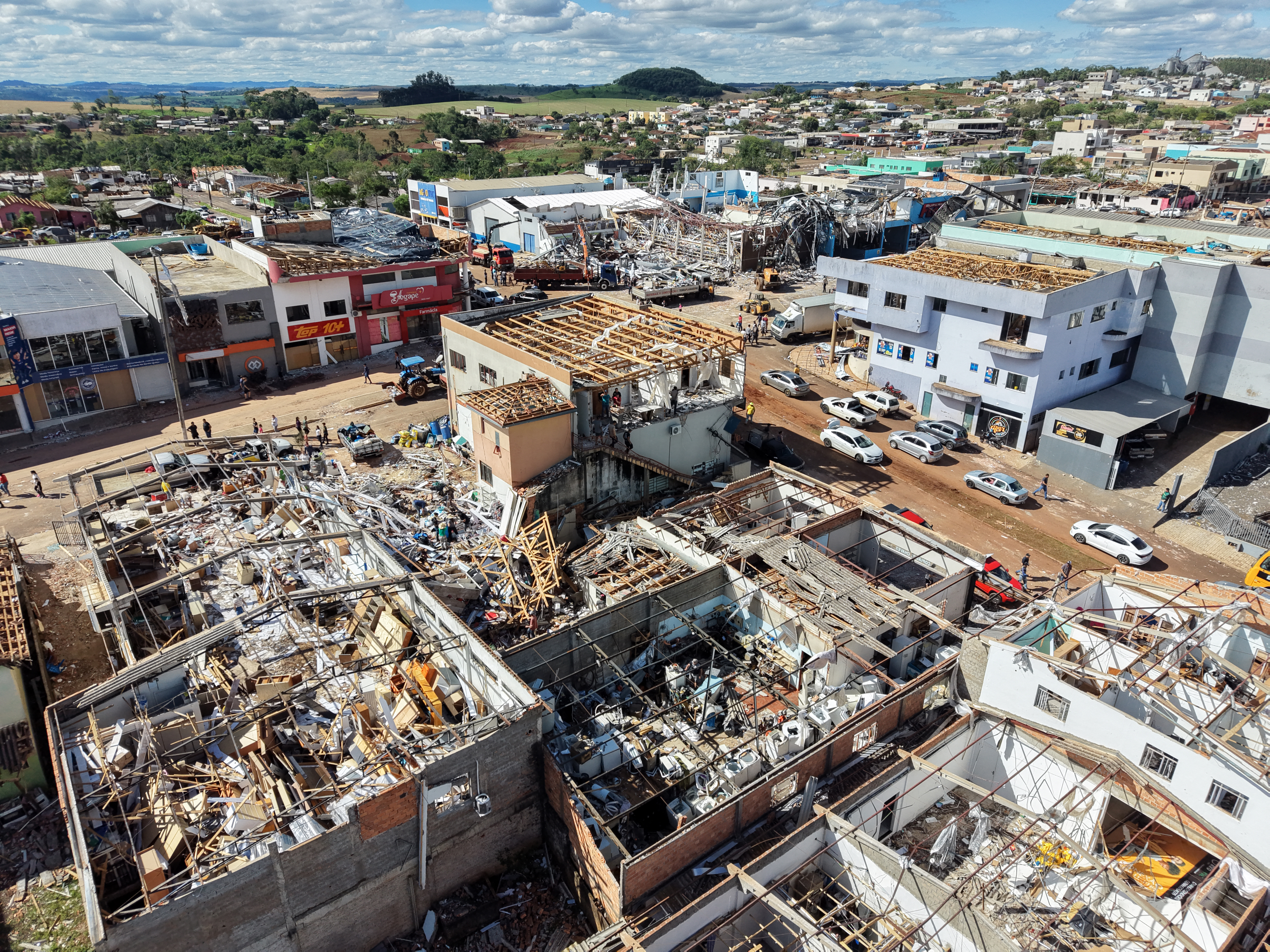 An aerial view shows destruction after a tornado hit the city of Rio Bonito do Iguacu, in Brazil's Parana State, on November 8, 2025. A tornado killed at least six people and injured around 750 as it destroyed most of a town in southern Brazil, authorities said Saturday. The twister on Friday evening flipped cars like toys and wrecked buildings in Rio Bonito do Iguacu, a town of 14,000 people in Parana state, officials said. (Photo by Daniel Castellano / AFP)