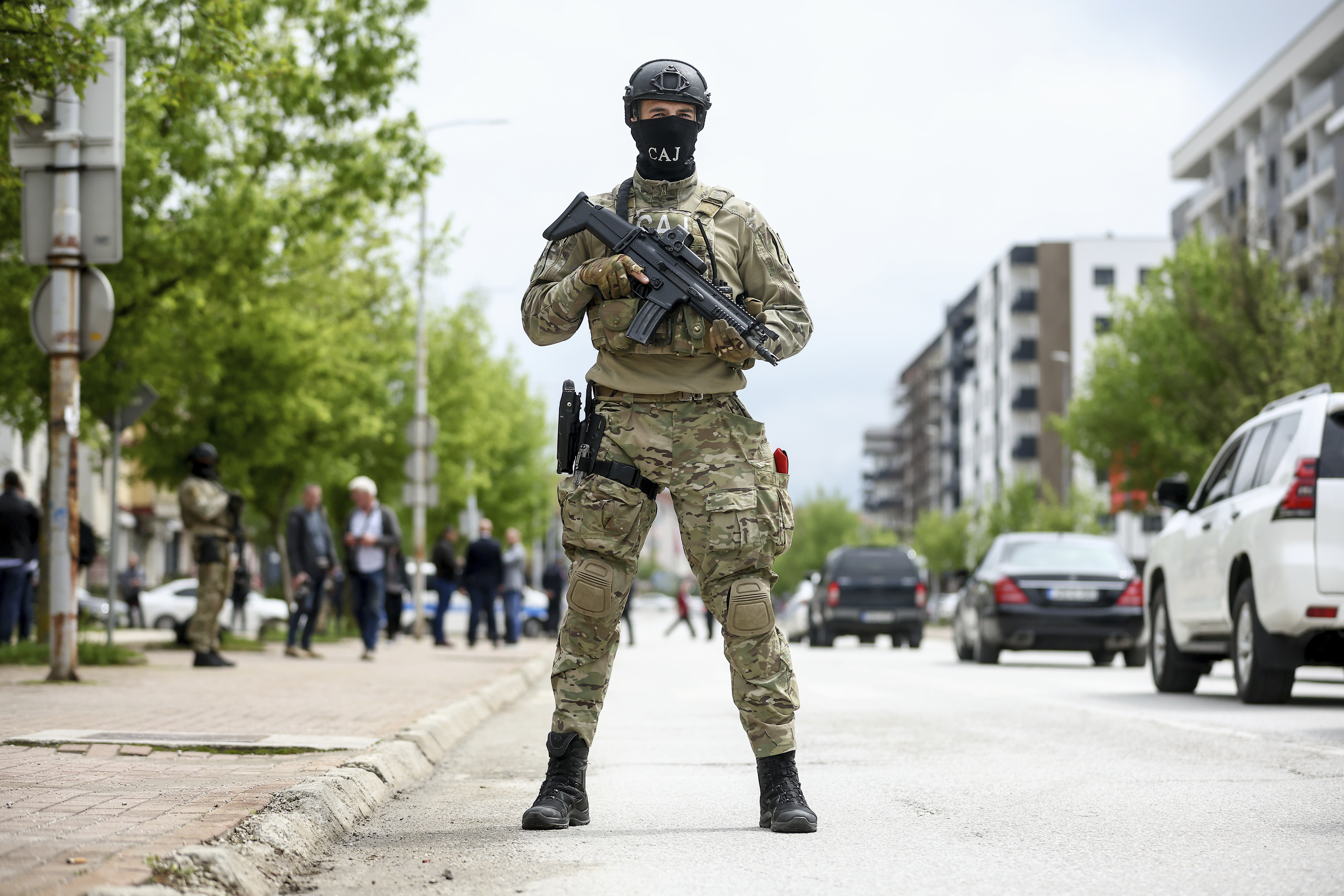 A member of the Special Anti-terrorist unit of police of Republika Srpska stands guard during the opening ceremony of the rectory building in Istocno Sarajevo, Bosnia, Thursday, April 24, 2025. (AP Photo/Armin Durgut)