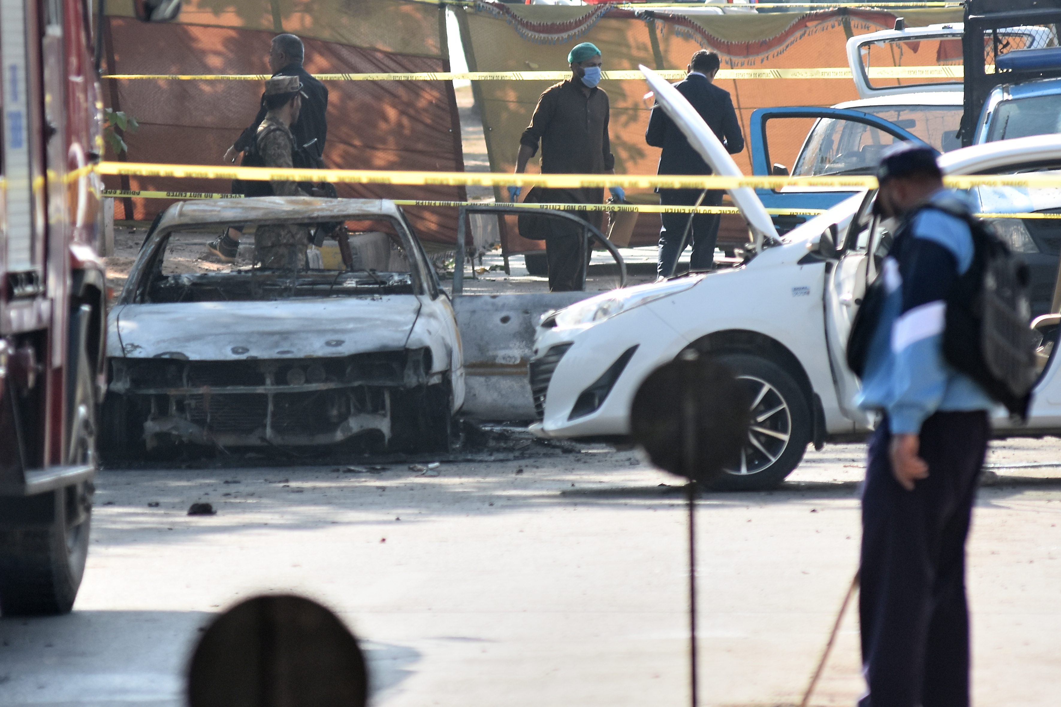 Pakistan's army police stand guard following a suicide bombing outside the gates of a district court, in Islamabad, Pakistan on November 11, 2025.