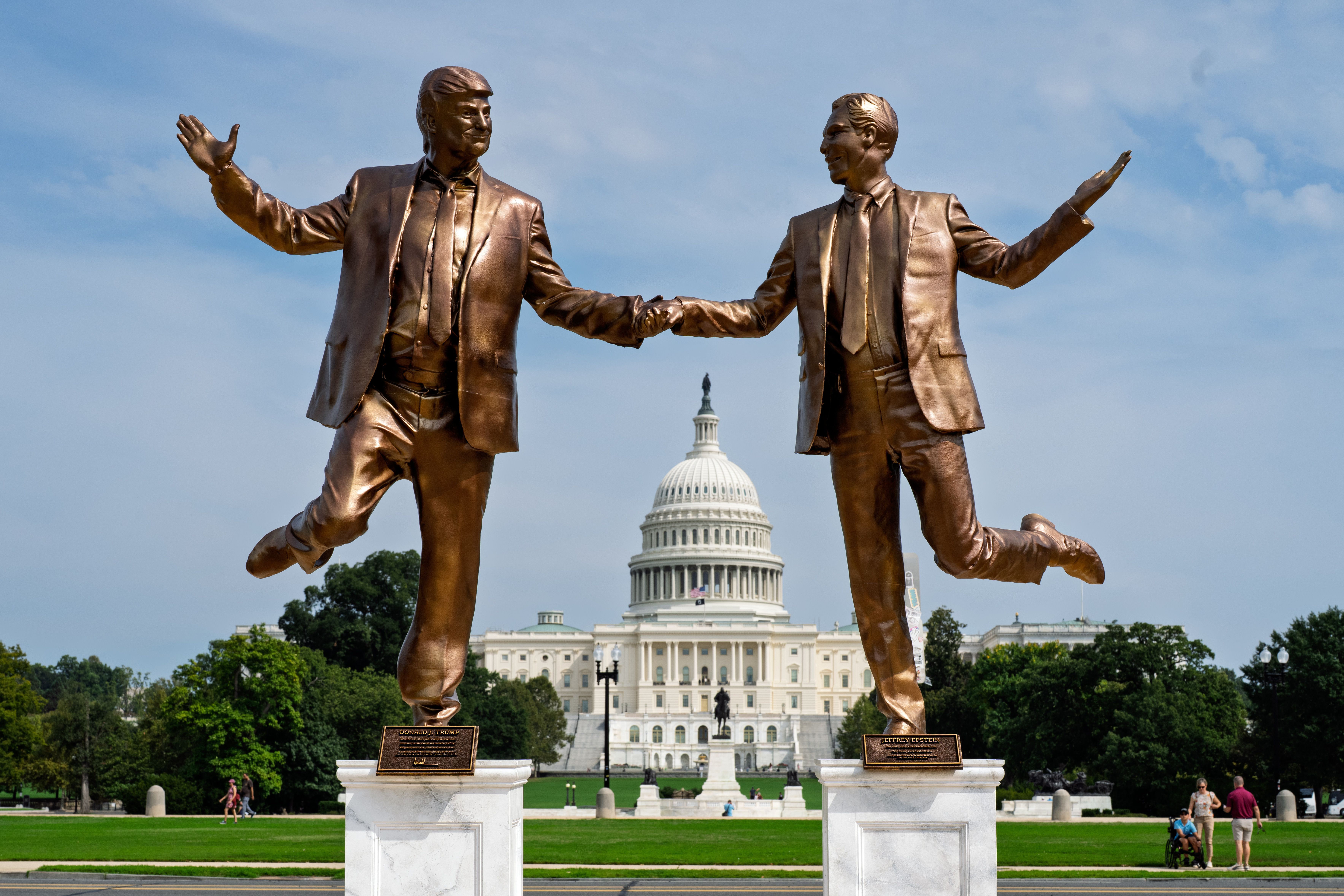 FILE—Statues representing President Donald Trump and Jeffrey Epstein, a work of protest art by free speech advocates, stand on the National Mall near the Capitol in Washington, Sept. 23, 2025. (AP Photo/J. Scott Applewhite, File)