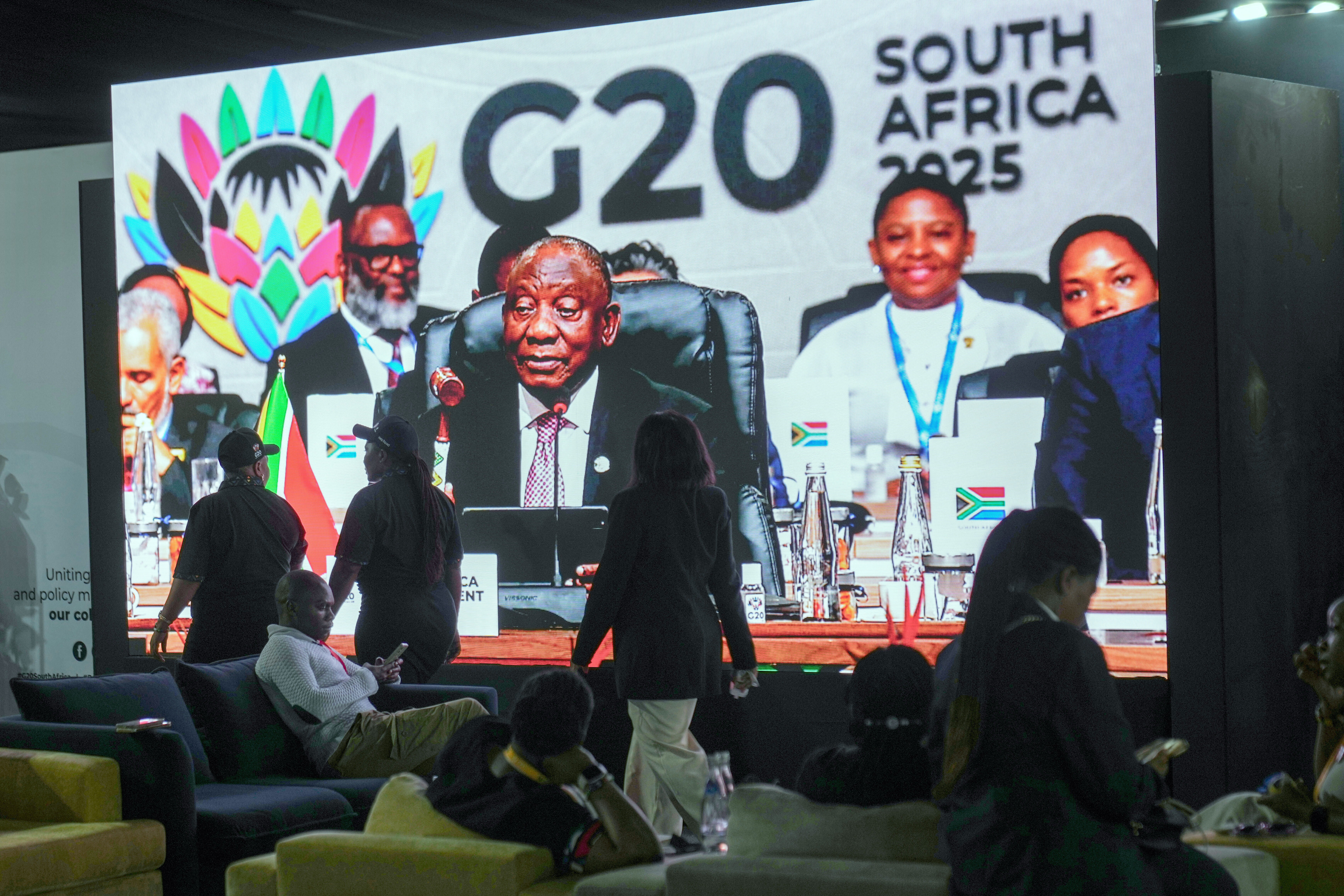 Cyril Ramaphosa with the G20 gavel on a screen