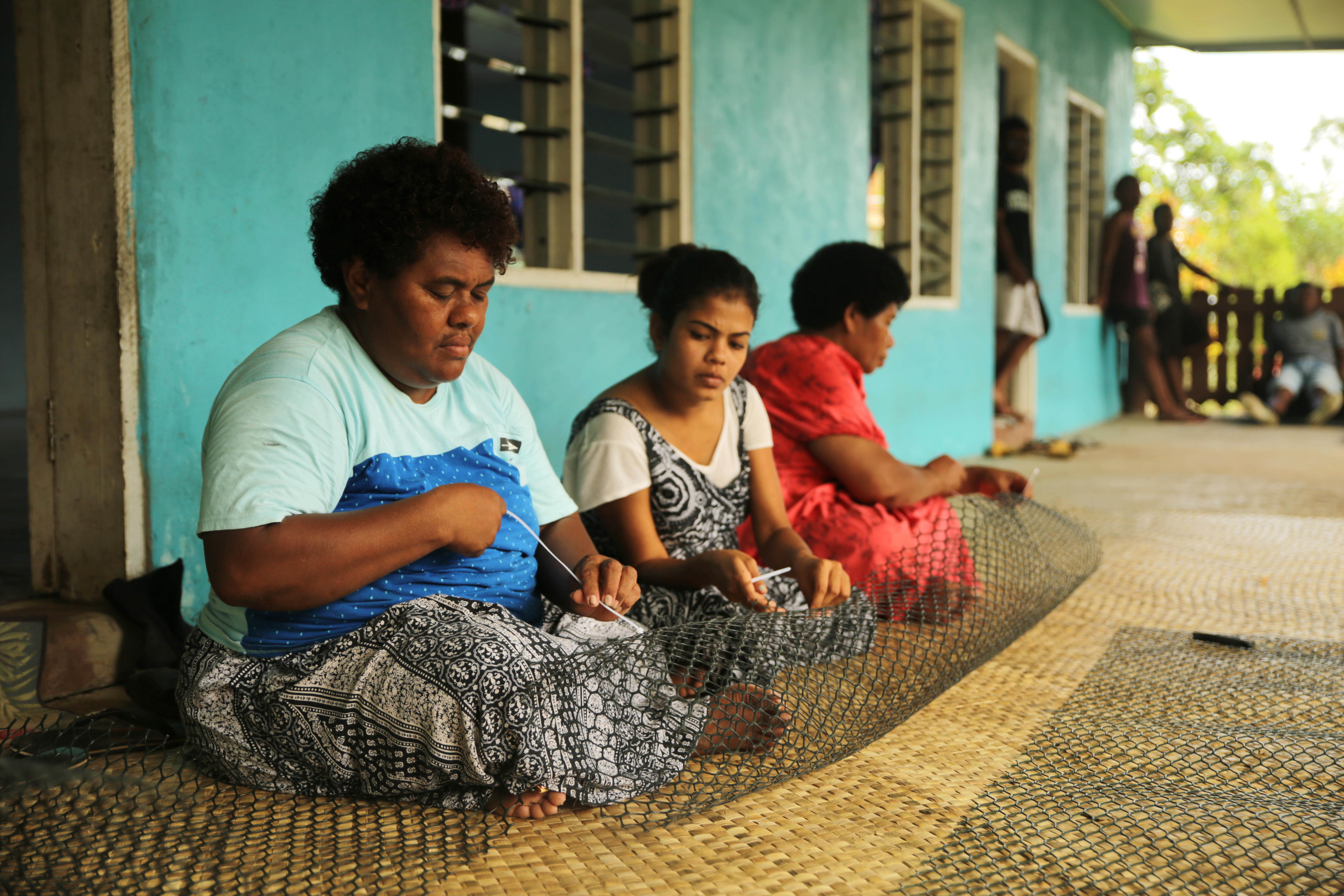 In Vatulele’s bright, turquoise community hall, women are learning how to haul in the lines, clean the oysters, and make predator nets from heavy-duty plastic.