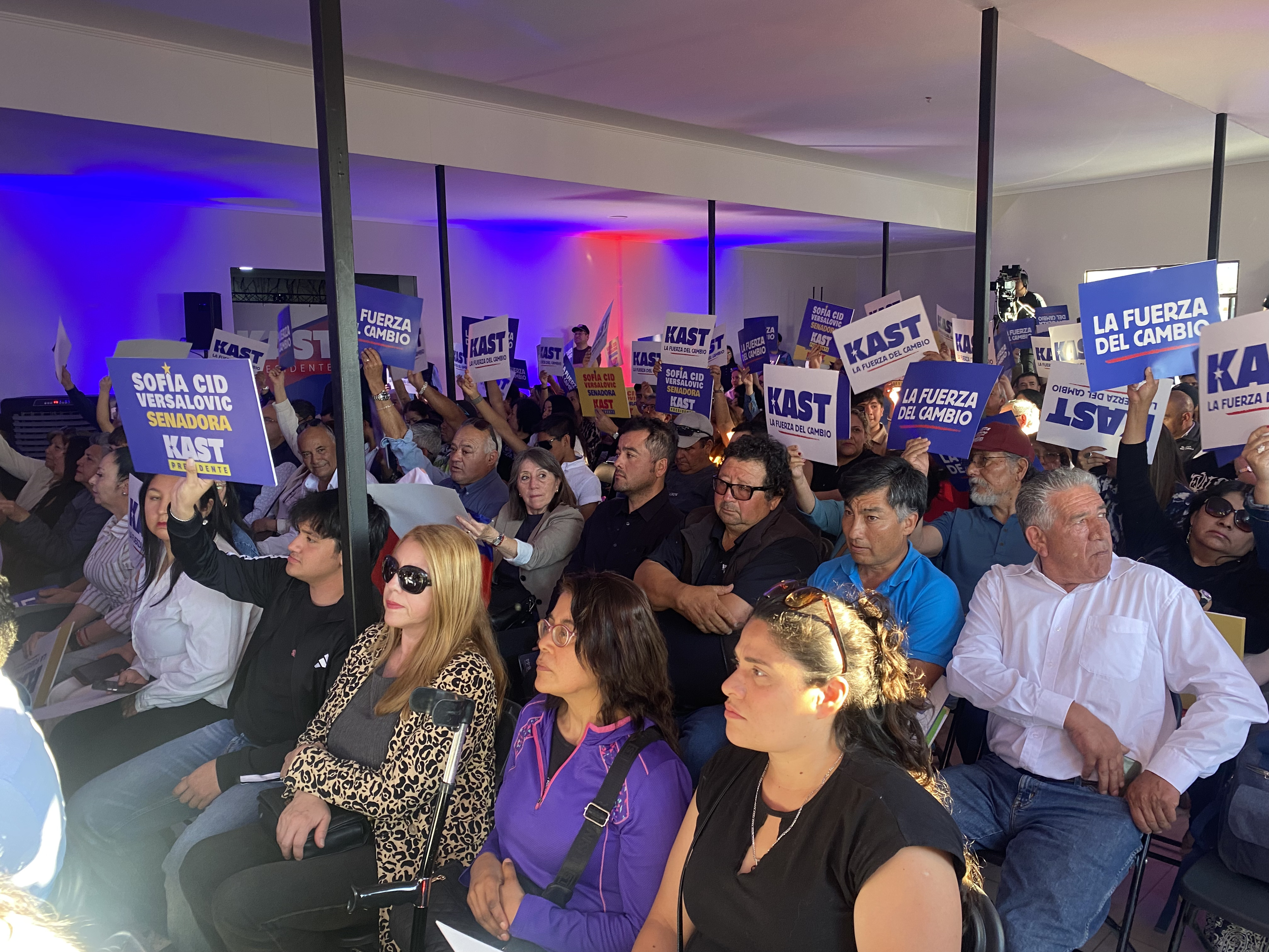 Supporters rally for Jose Antonio Kast at an indoor rally
