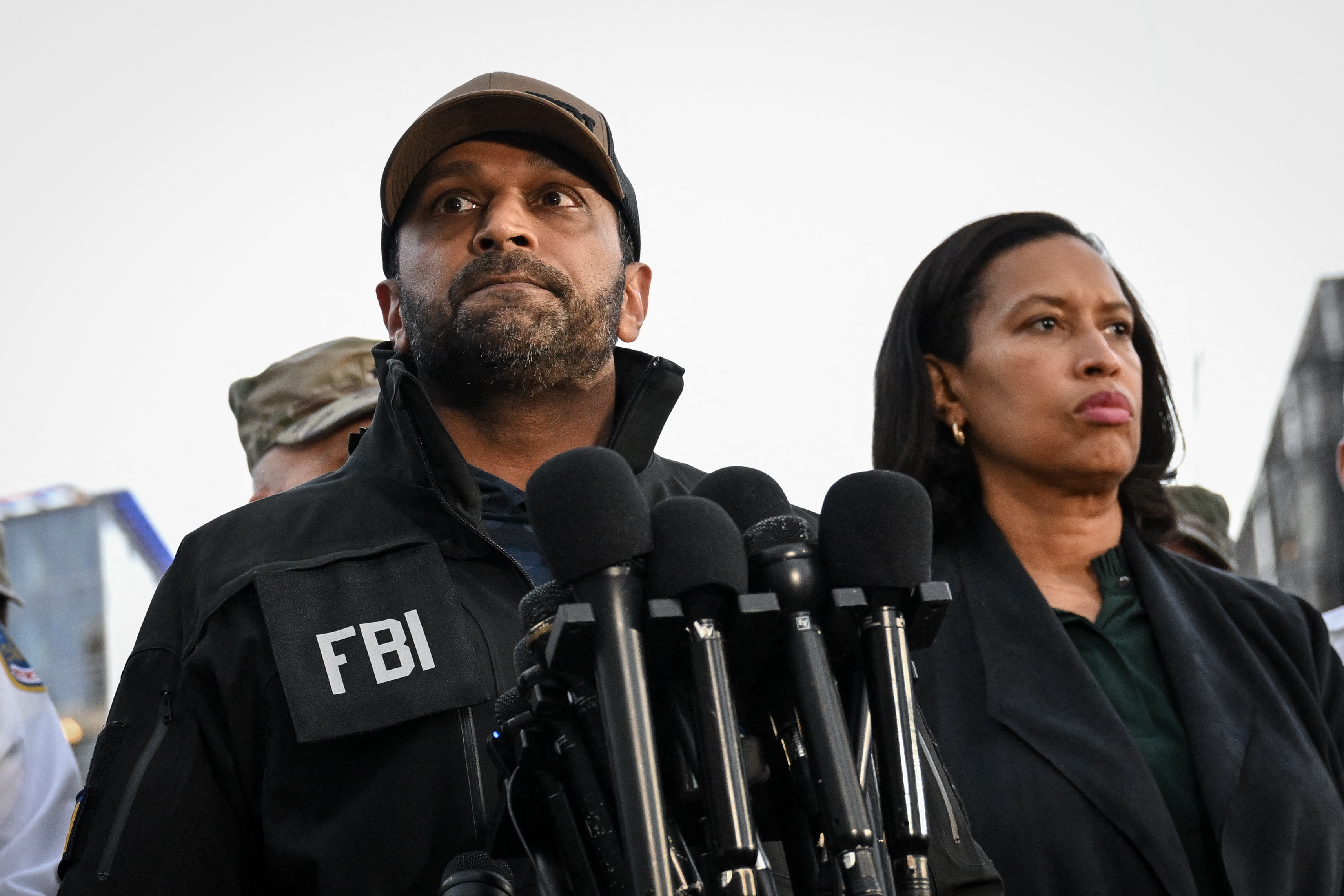 FBI Director Kash Patel (L) speaks as the District of Columbia mayor Muriel Bowser looks on during a press conference after a shooting in downtown Washington, on November 26, 2025.