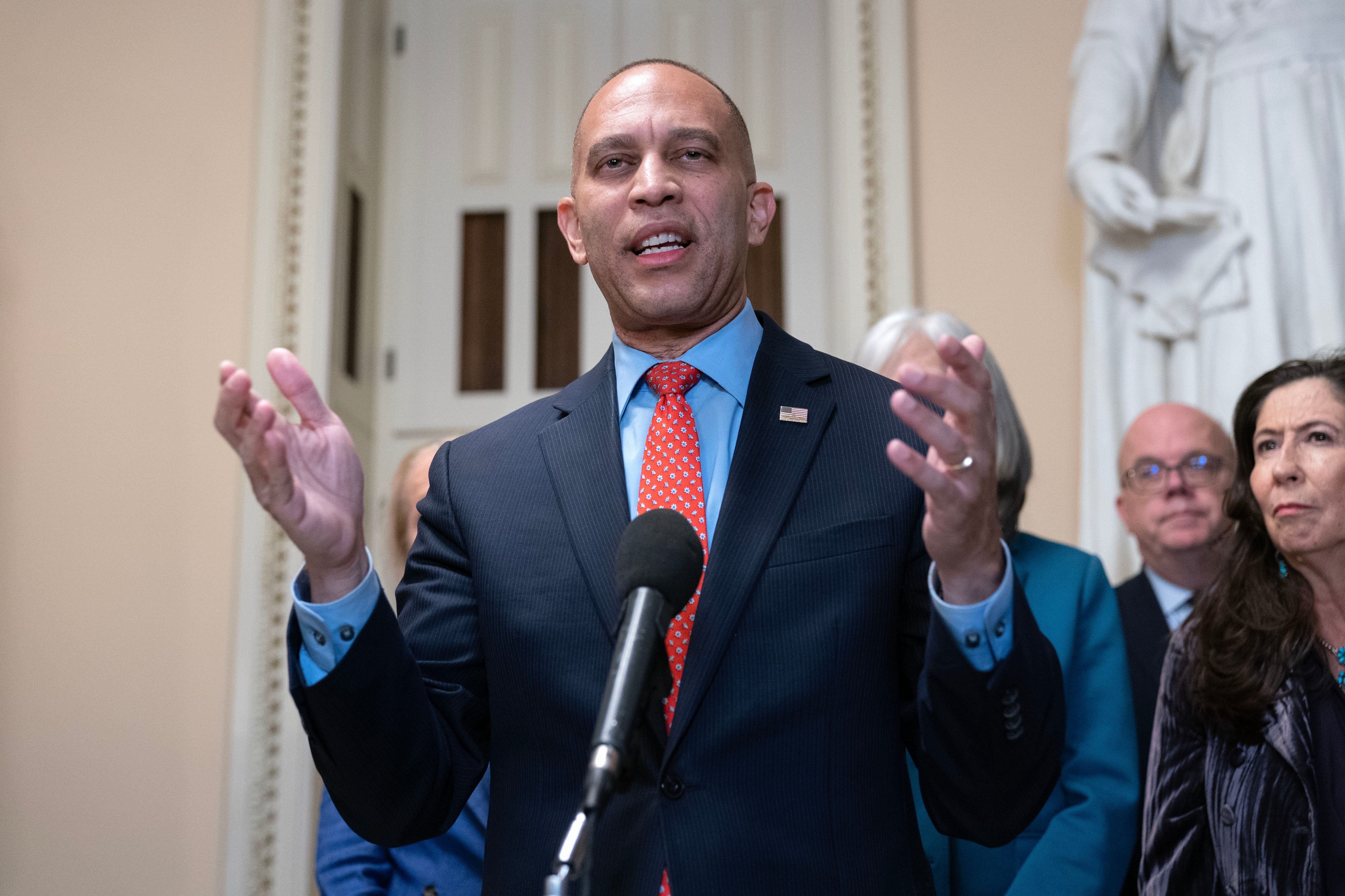 House Minority Leader Hakeem Jeffries, D-N.Y., talks to reporters a day before the House prepares to vote on a bill to reopen the government at the Capitol in Washington, Tuesday, Nov. 11, 2025. (AP Photo/Jose Luis Magana)