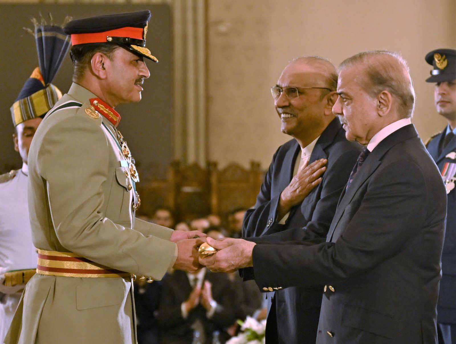 President Asif Ali Zardari and Prime Minister Muhammad Shehbaz Sharif jointly conferred the baton of Field Marshal upon Chief of Army Staff (COAS) Field Marshal Syed Asim Munir during a special investiture ceremony at Aiwan-e-Sadr in Islamabad. [Handout/Government of Pakistan]