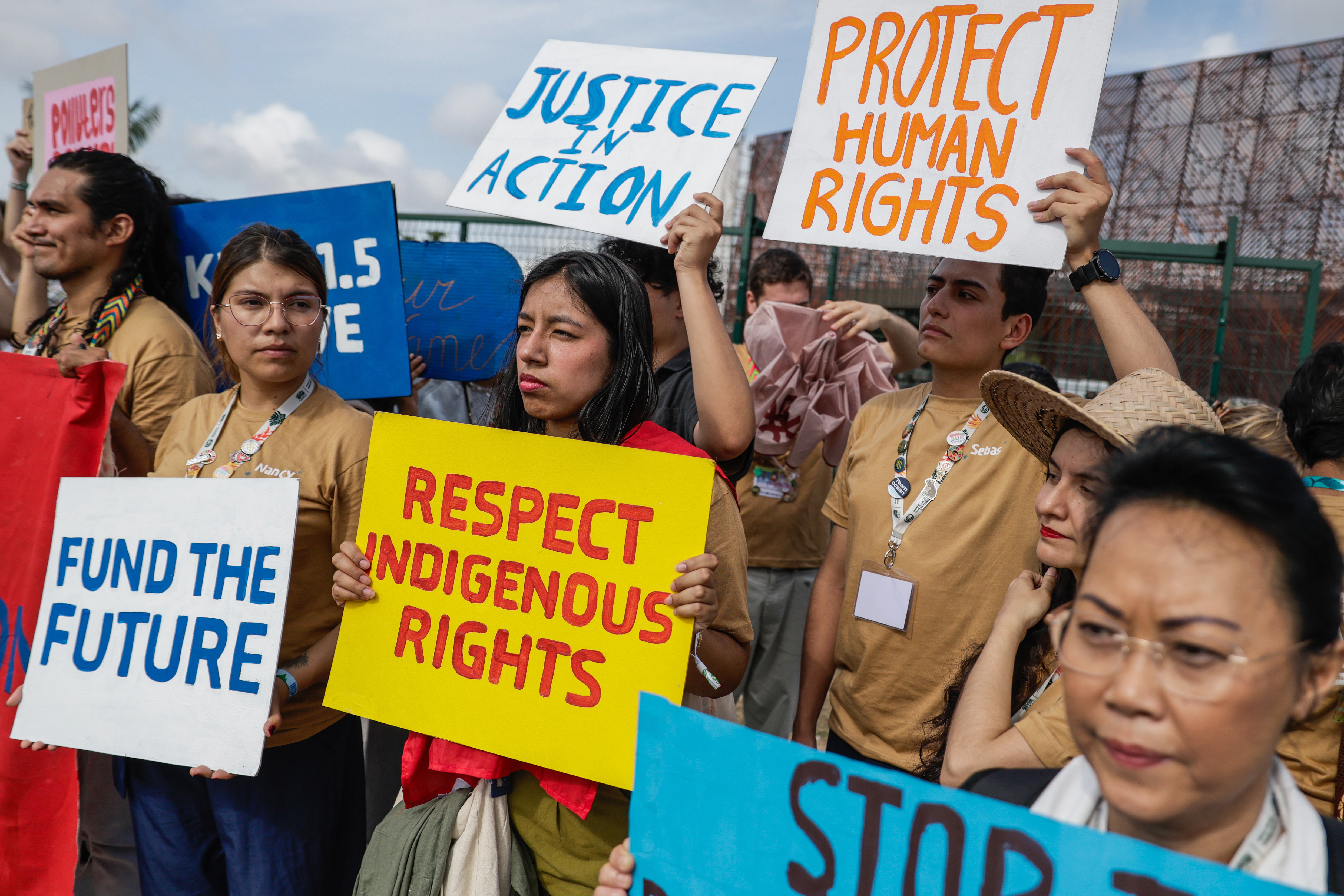 epa12535960 People demonstrate during a protest against fossil fuels, calling for the rights of indigenous communities to be respected at the entrance to the Blue Zone of COP30 in Belem, Brazil, 19 November 2025. EPA/FRAGA ALVES