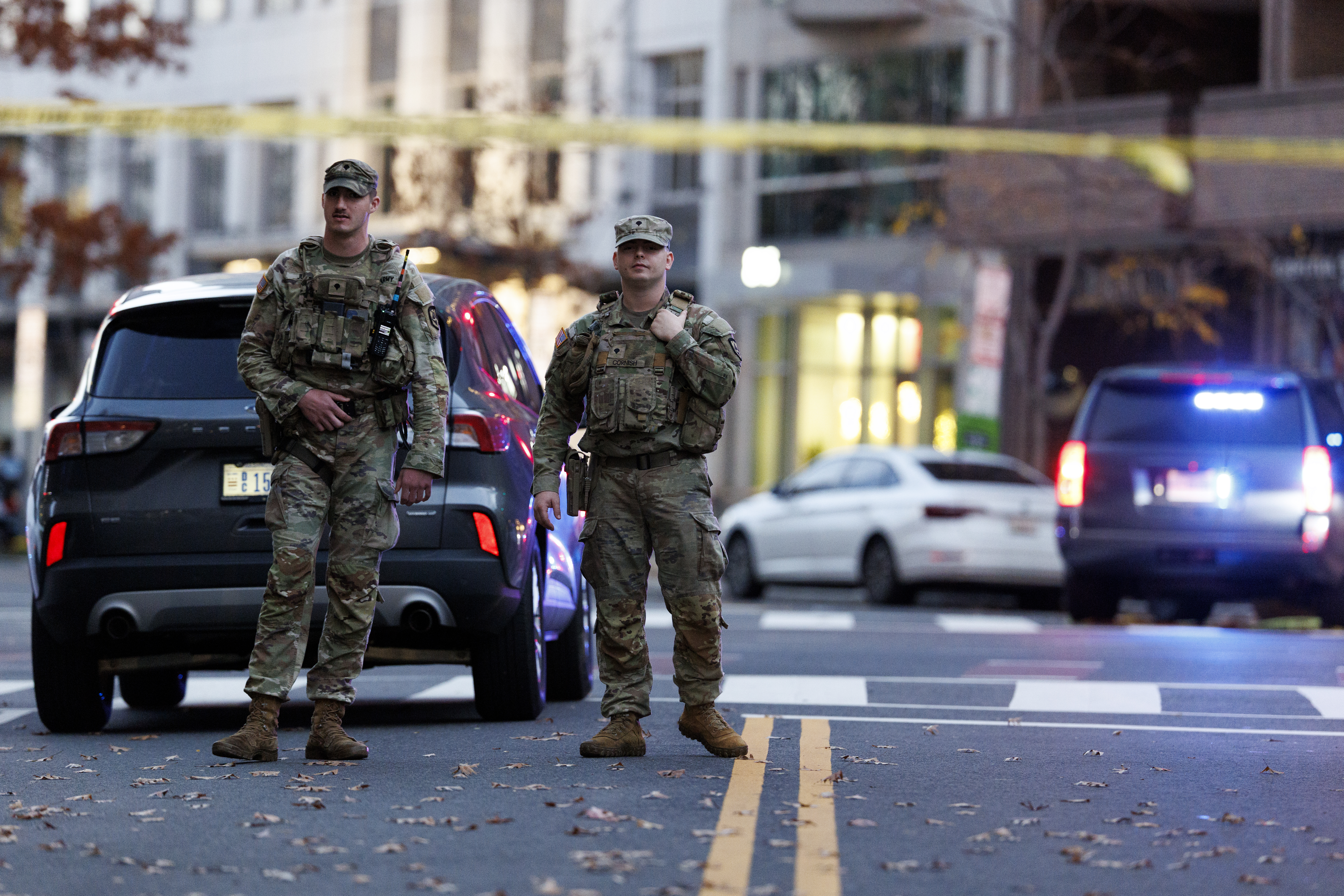 epa12551529 National Guardsmen stand close to the scene where two West Virginia National Guard members were shot in Washington, DC, USA, 26 November 2025. EPA/WILL OLIVER
