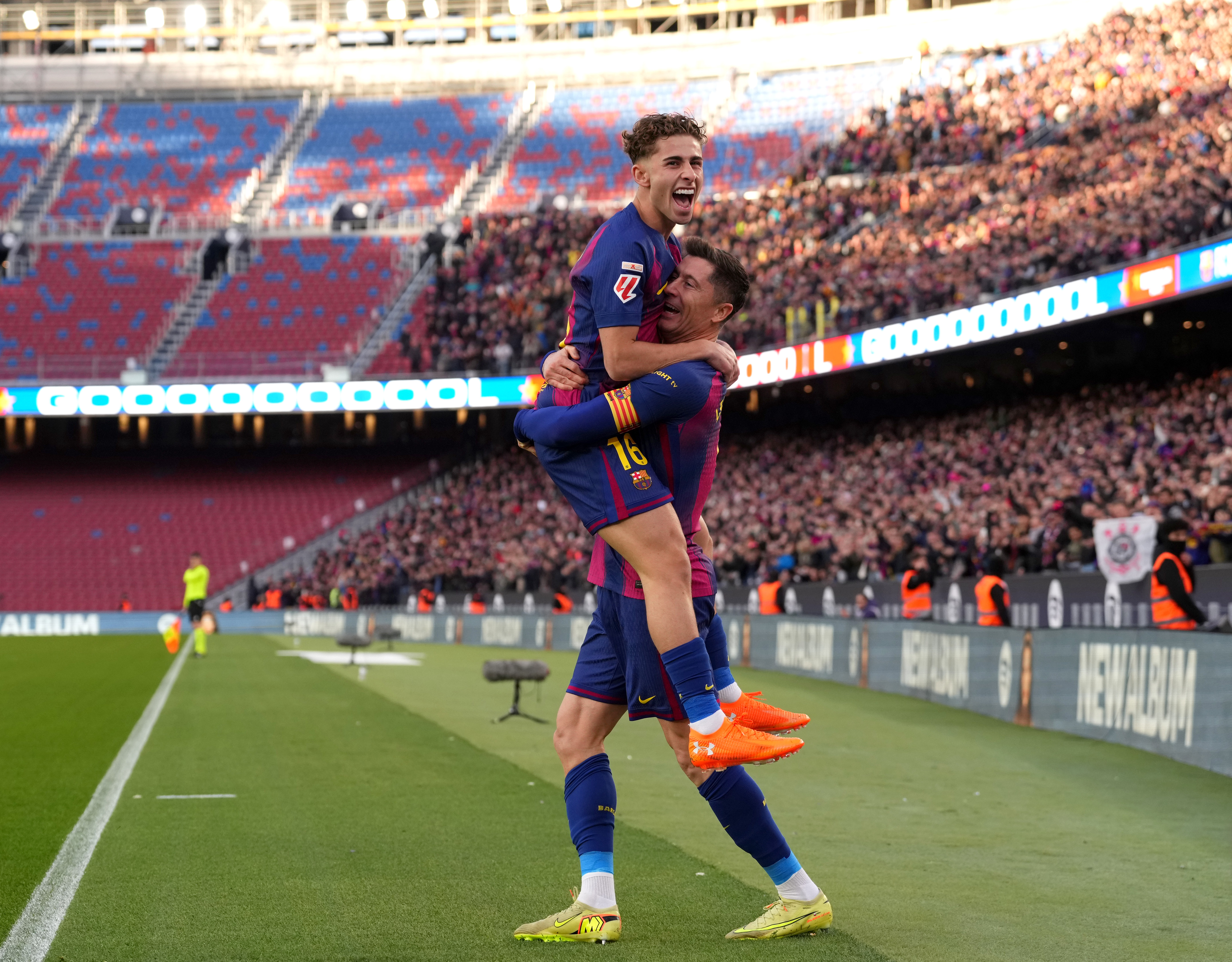 BARCELONA, SPAIN - NOVEMBER 22: Robert Lewandowski of FC Barcelona celebrates scoring his team's first goal with teammate Fermin Lopez during the LaLiga EA Sports match between FC Barcelona and Athletic Club at Spotify Camp Nou on November 22, 2025 in Barcelona, Spain. (Photo by Alex Caparros/Getty Images)