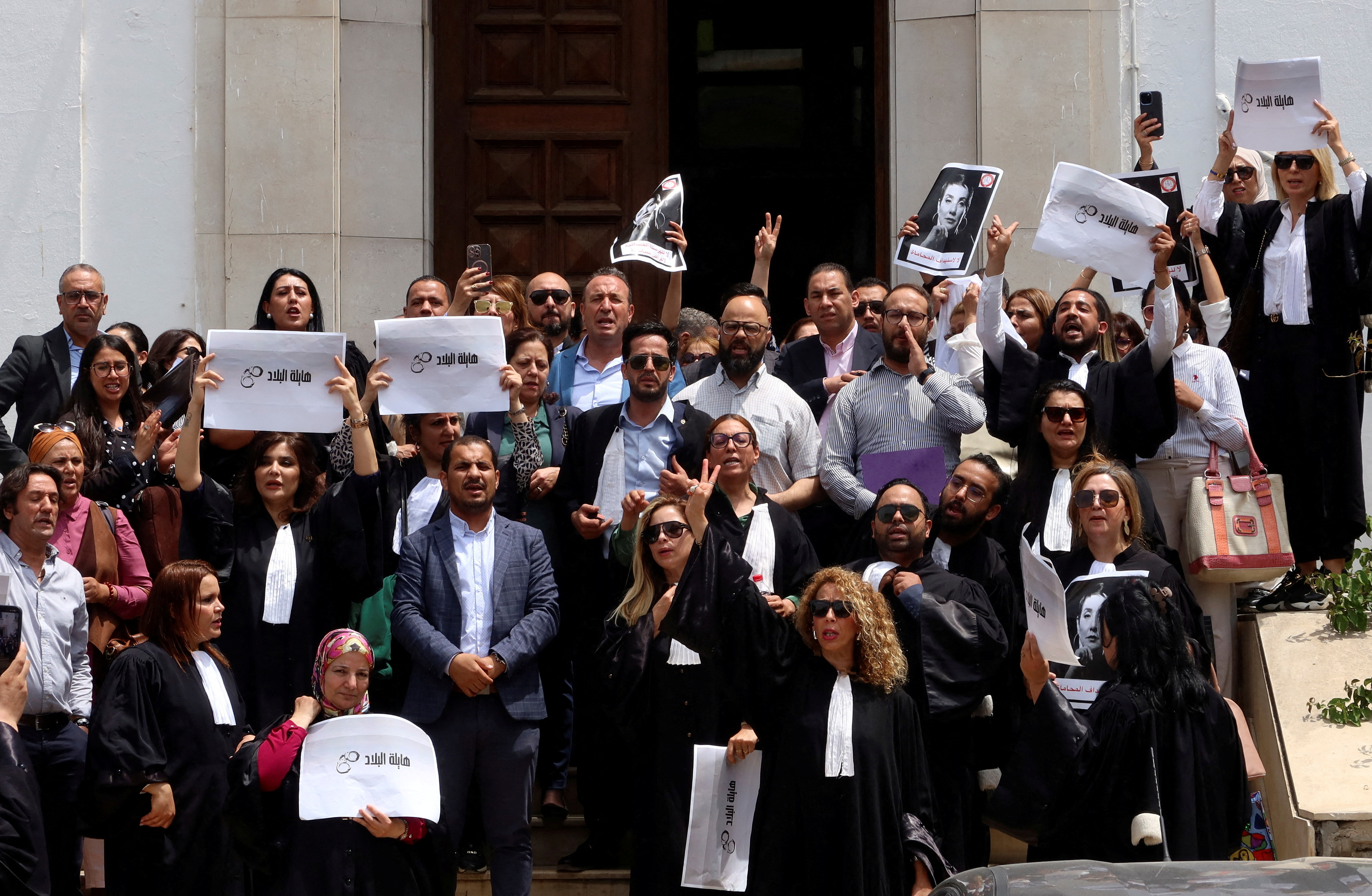 FILE PHOTO: Lawyers carry banners during a protest against the arrest of Sonia Dahmani, a prominent lawyer critical of the president, outside the Palace of Justice building in Tunis, Tunisia May 13, 2024. REUTERS/Jihed Abidellaoui/File Photo