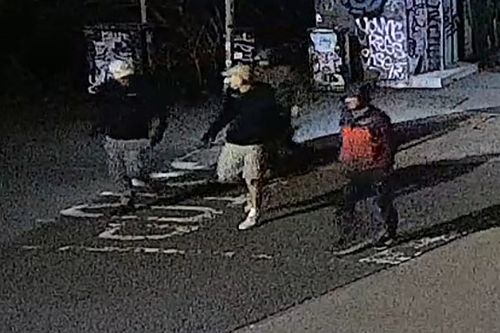 This handout image of CCTV footage released by Avon and Somerset Police on December 11, 2025 shows men in the early hours of September 25 in the city of Bristol, south-west England outside a building which housed items from the Bristol Museum's British Empire and Commonwealth collection. [Handout/ Avon and Somerset Police/AFP]