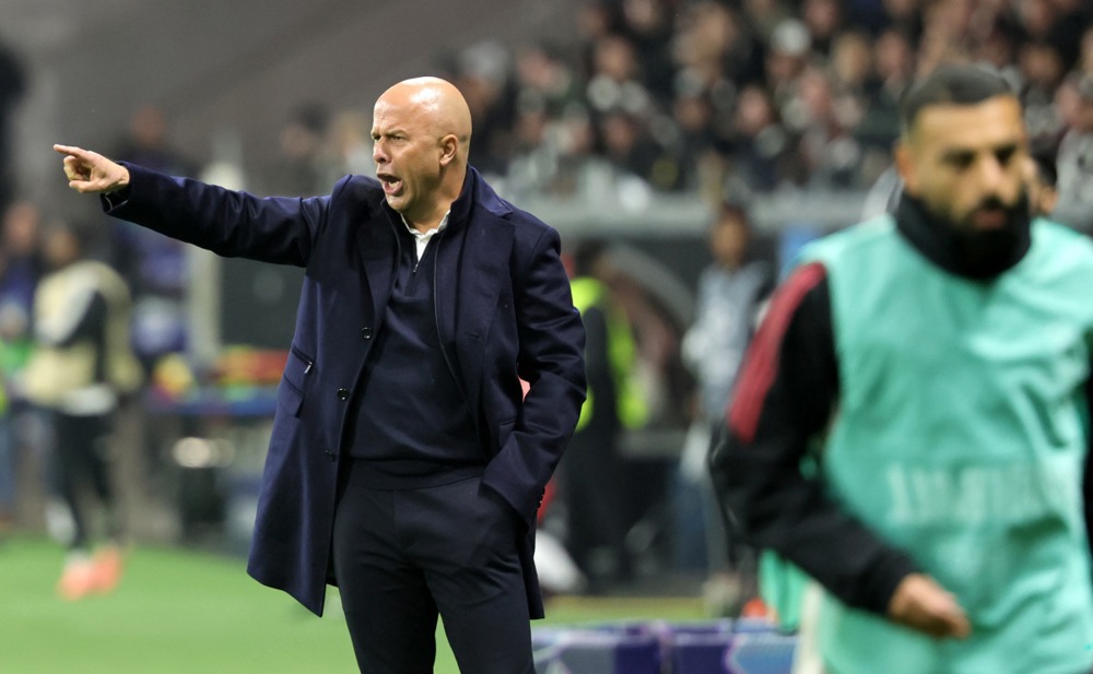 Liverpool manager Arne Slot gestures on the touchline.