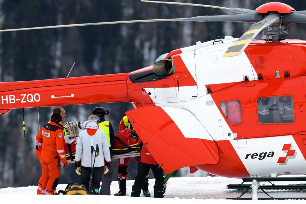 Michelle Gisin of Switzerland carried on a stretcher after a fall, is being airlifted by a Rega helicopter during the women's Downhill training race at the Alpine Skiing FIS Ski World Cup