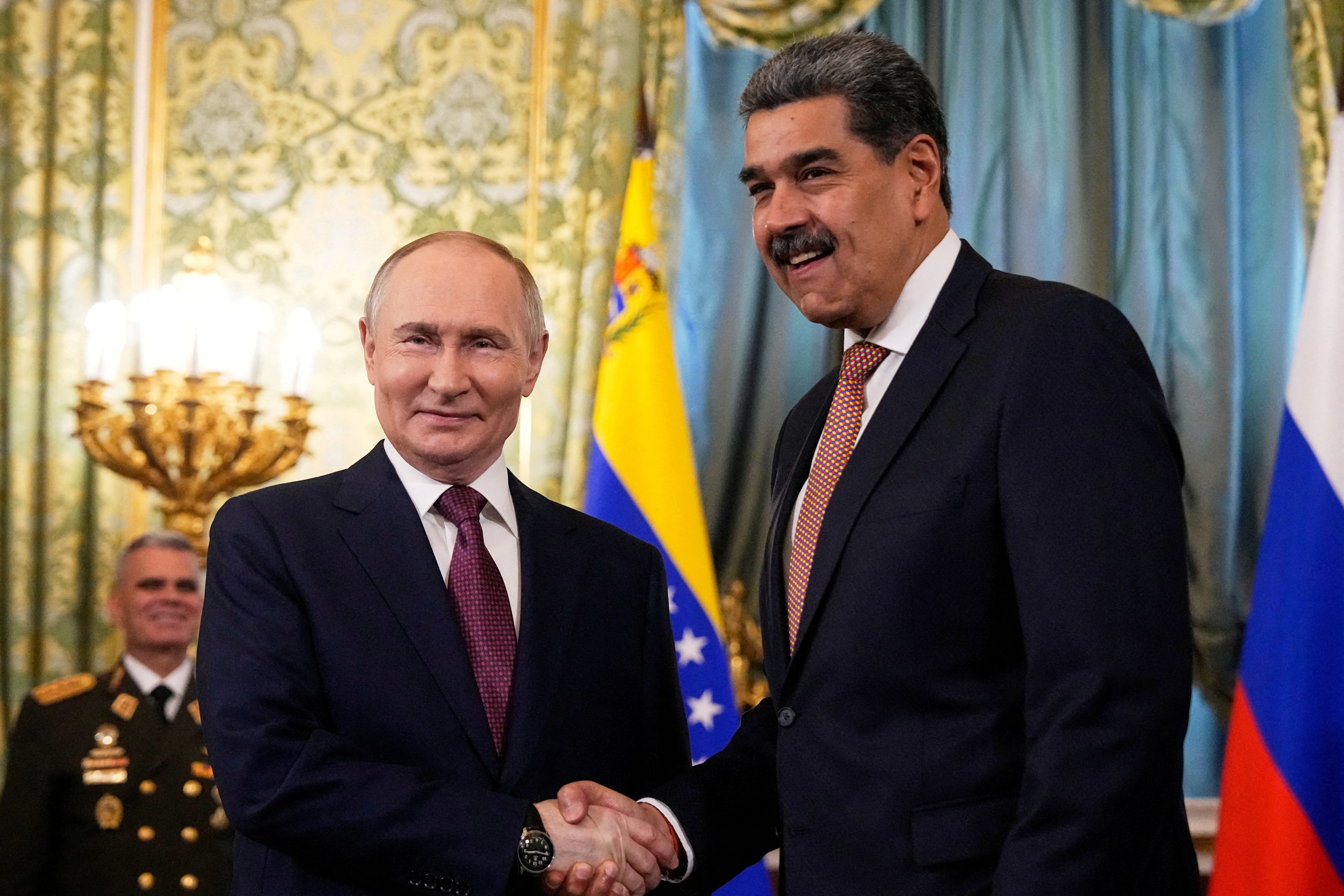 Russian President Vladimir Putin shakes hands with his Venezuelan counterpart, Nicolas Maduro, during a meeting at the Kremlin in Moscow in May 2025