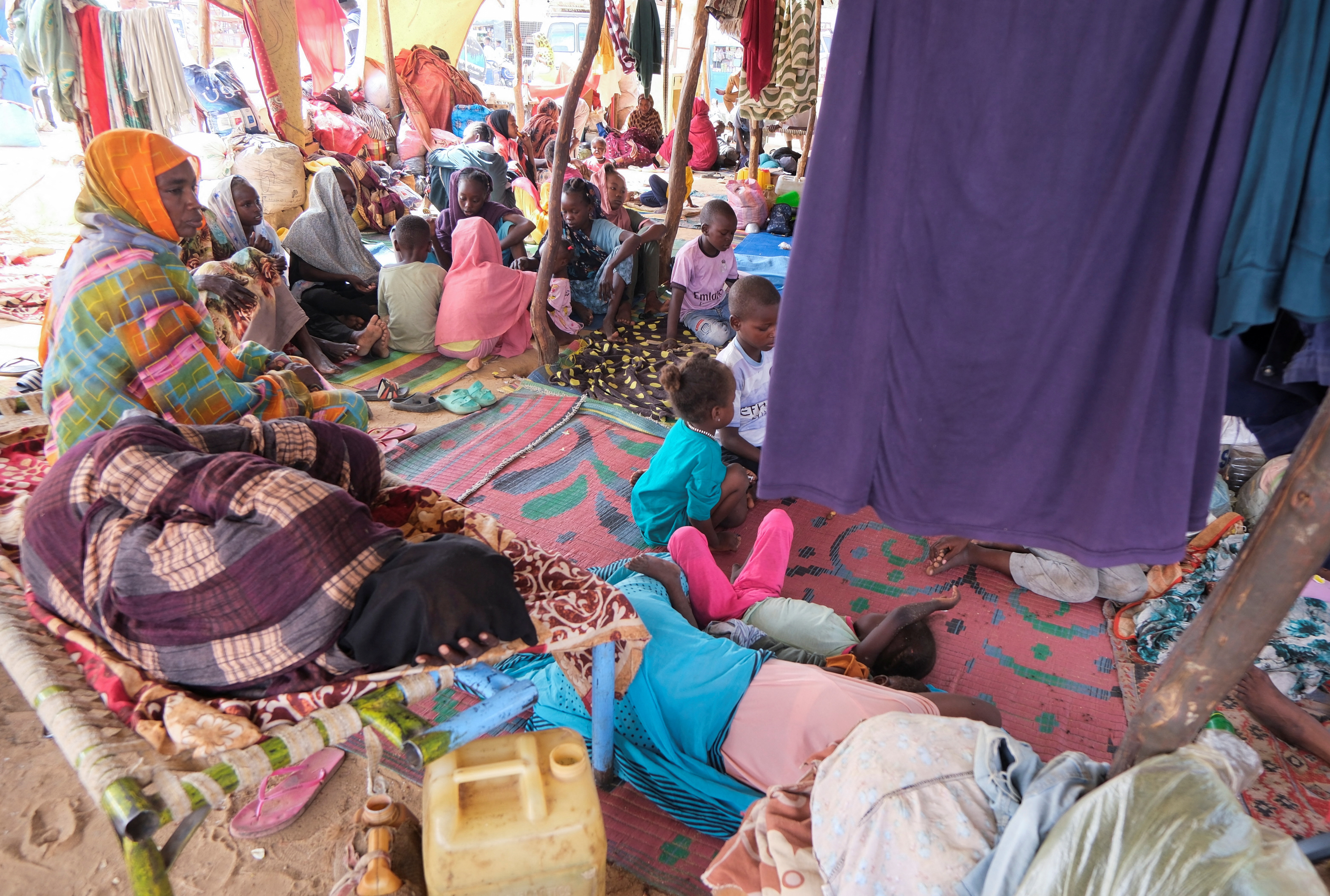 Sudanese women who fled intense fighting in al-Fashir sit at a displacement camp, as the humanitarian situation deteriorates amid the ongoing conflict between the paramilitary Rapid Support Forces (RSF) and the Sudanese army, in Al Dabba, Sudan, September 6, 2025. REUTERS/El Tayeb Siddig