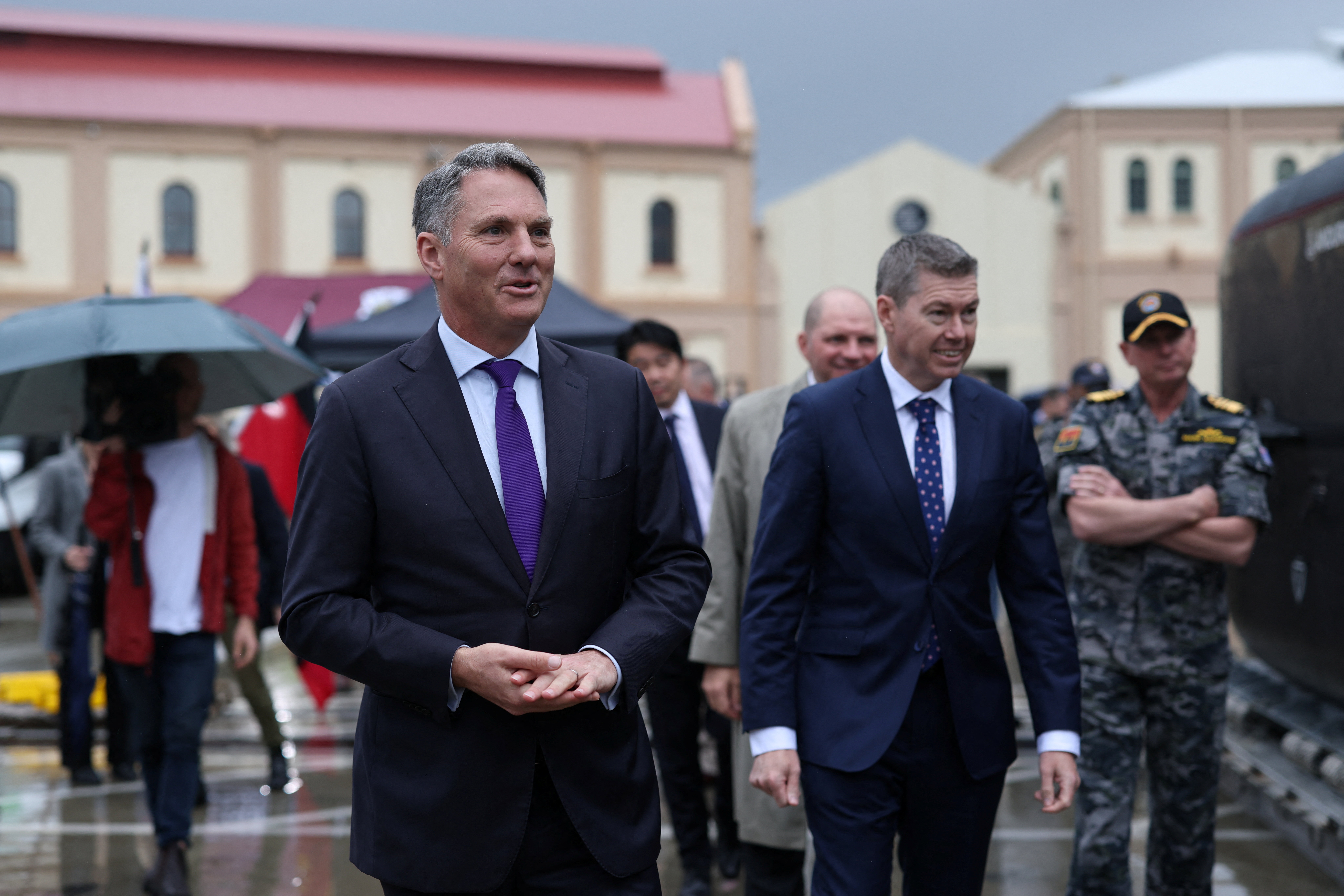 Richard Marles, Australian Deputy Prime Minister and Minister for Defence, and Pat Conroy, Australian Minister for Defence Industry, inspect a Anduril Ghost Shark Extra Large Autonomous Undersea Vehicle (XL-AUV) displayed at the Royal Australian Navy base HMAS Kuttabul, in Sydney, Australia, September 10, 2025. REUTERS/Hollie Adams
